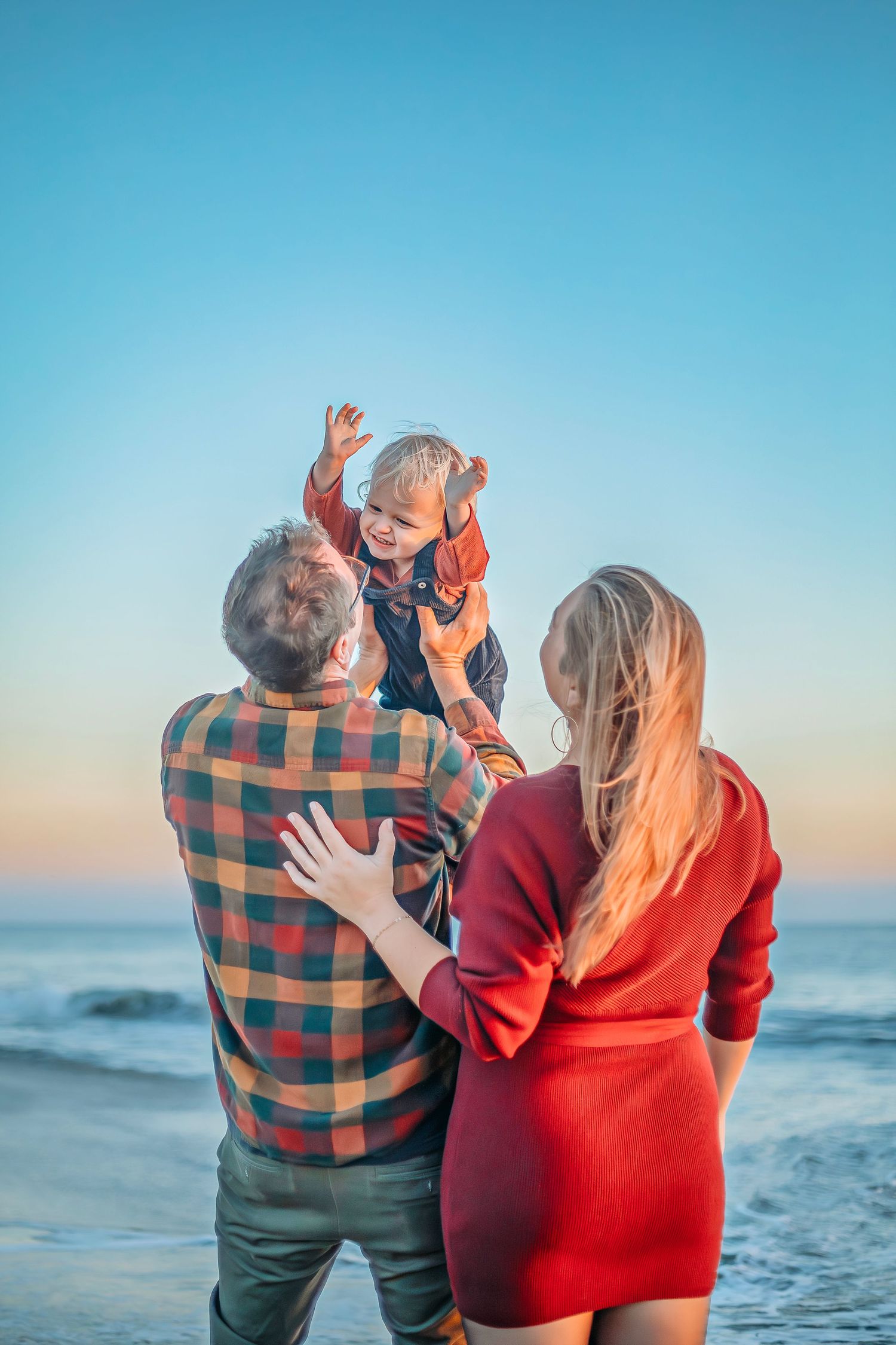 Family enjoying at the beach in Santa Cruz, captured in natural light with candid moments, ocean views, and a relaxed coastal setting