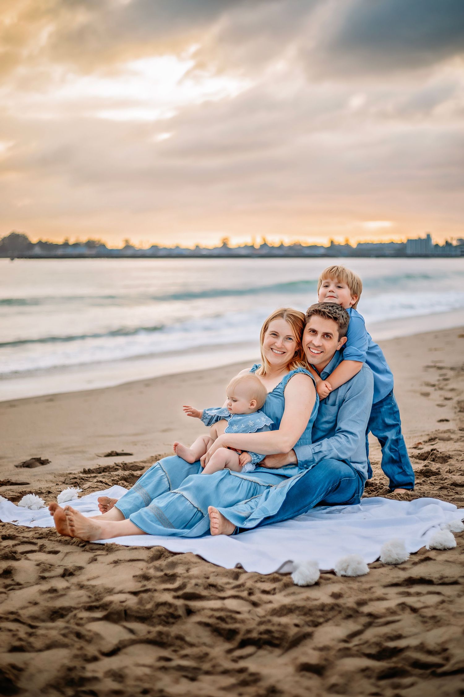 Family enjoying at the beach in Santa Cruz, captured in natural light with candid moments, ocean views, and a relaxed coastal setting