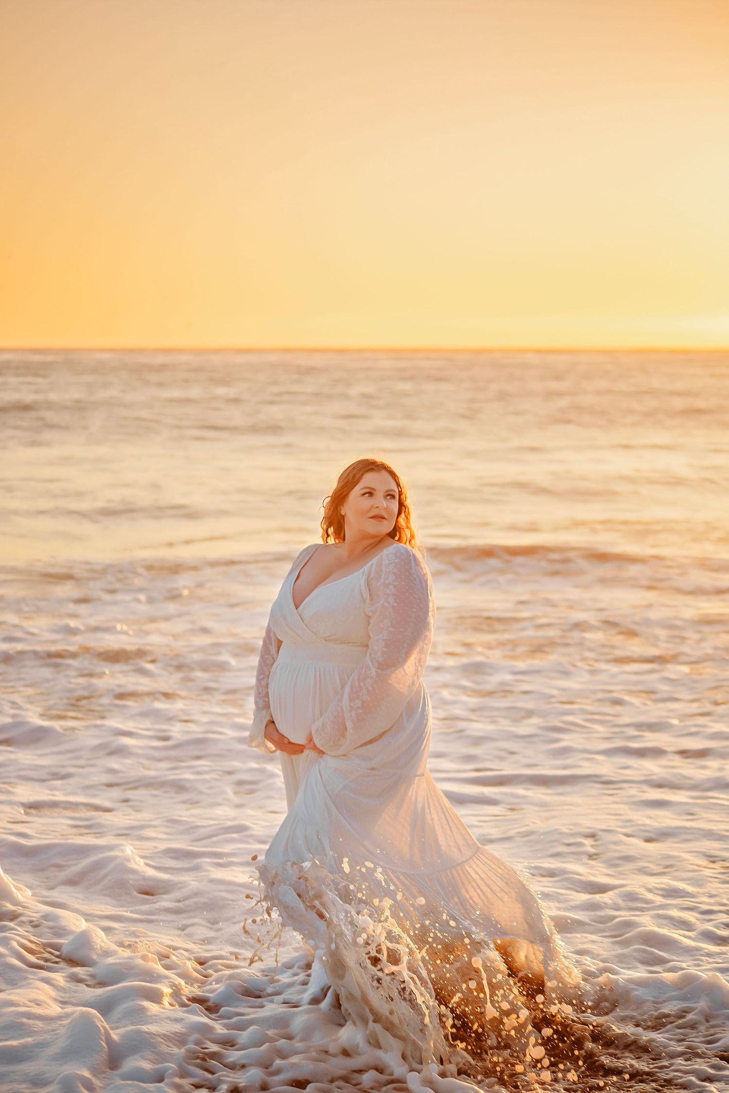 maternity photo session at a Santa Cruz beach, candid moments, ocean views, and a warm, relaxed coastal atmosphere.