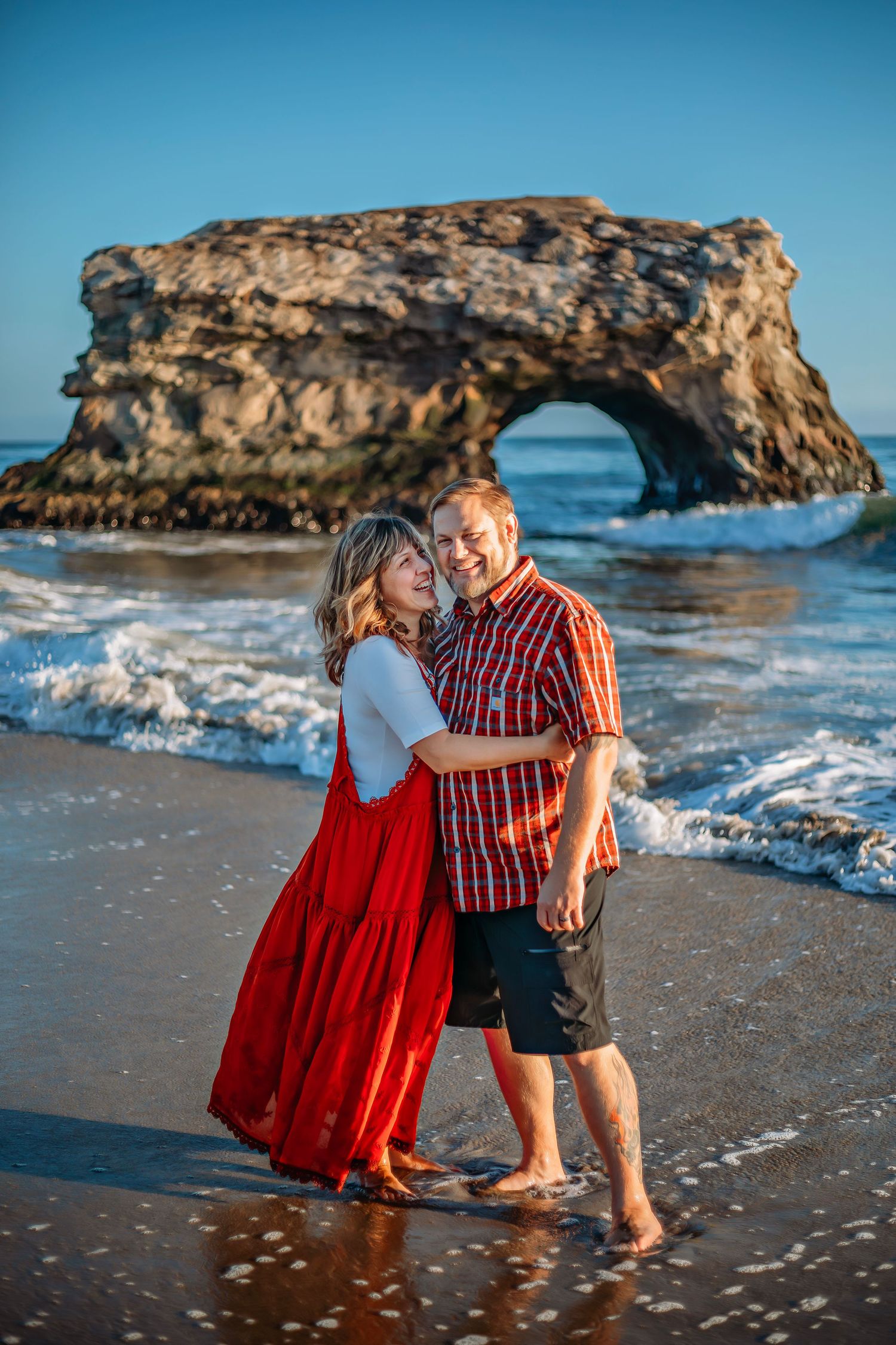 A couple enjoying at the beach in Santa Cruz, captured in natural light with candid moments, ocean views, and a relaxed coastal setting