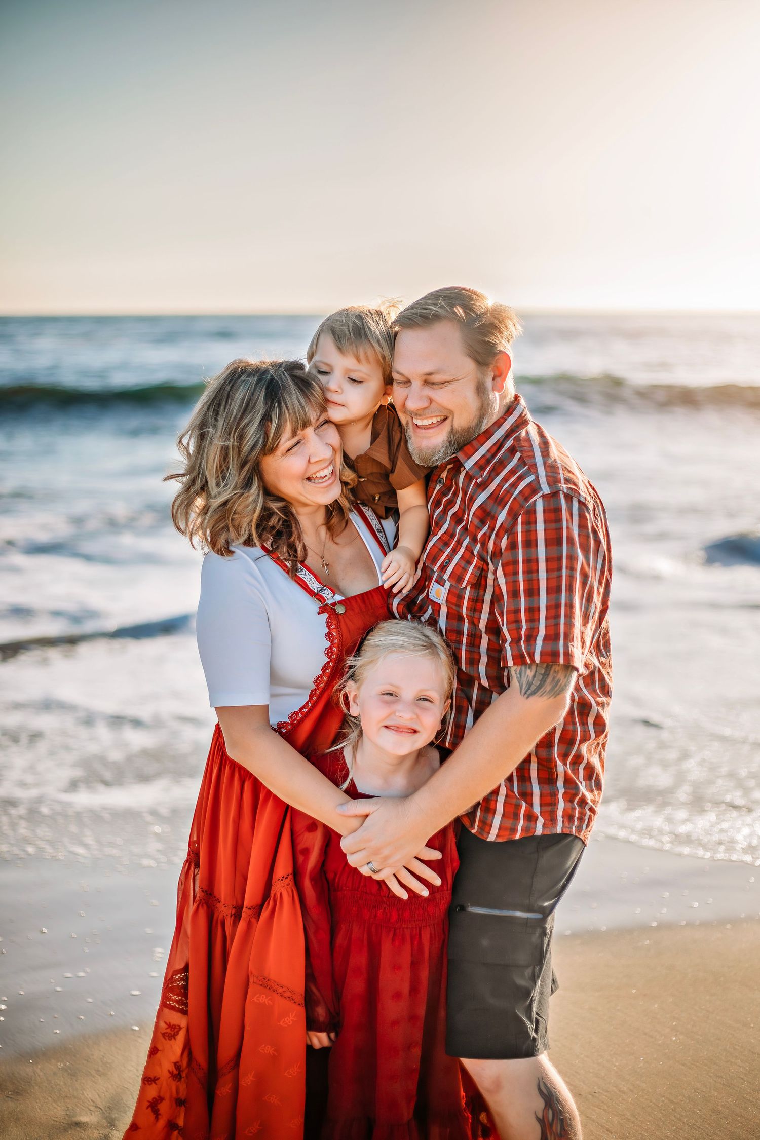 Family enjoying at the beach in Santa Cruz, captured in natural light with candid moments, ocean views, and a relaxed coastal setting
