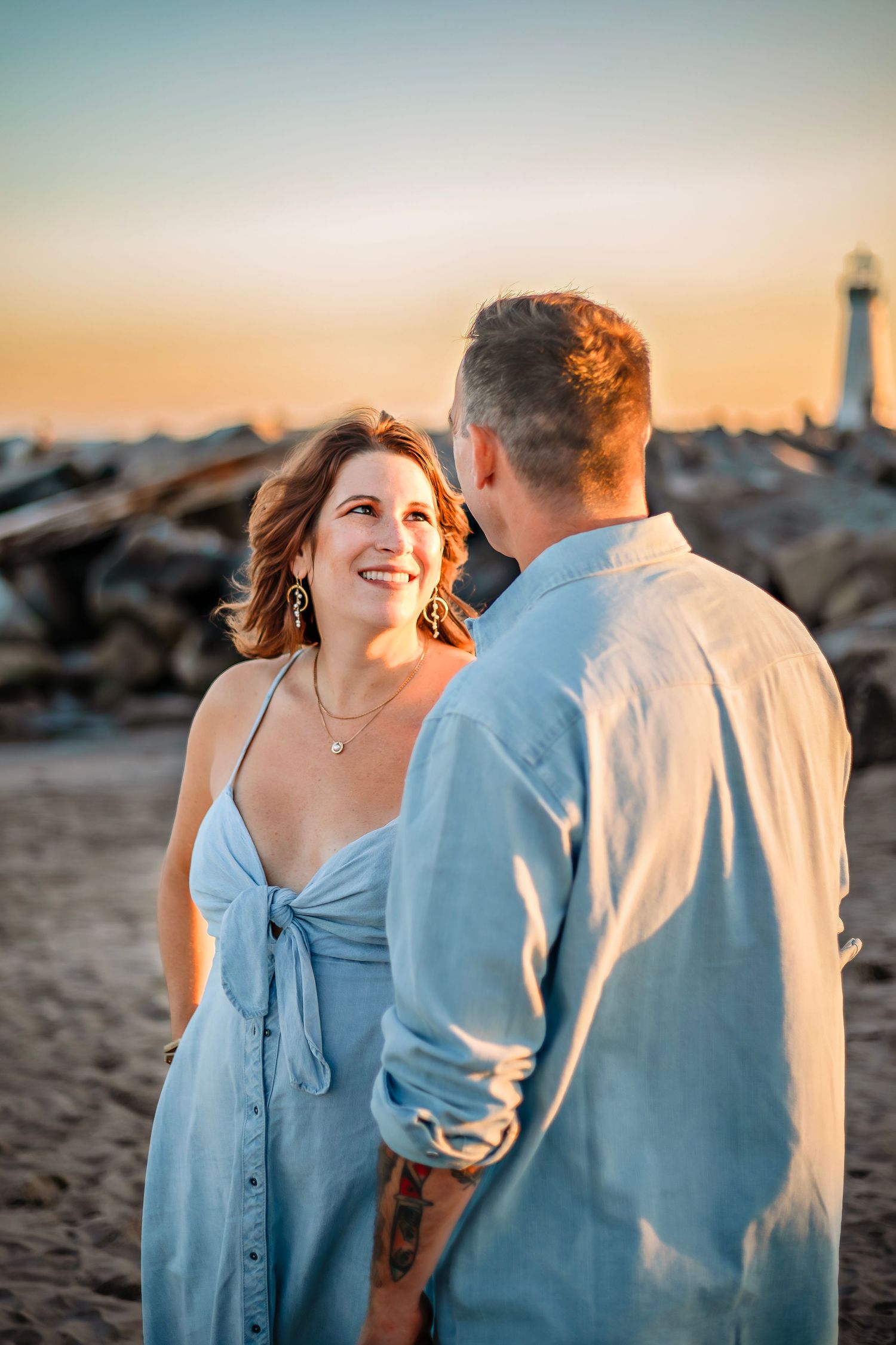 A couple enjoying at the beach in Santa Cruz, captured in natural light with candid moments, ocean views, and a relaxed coastal setting