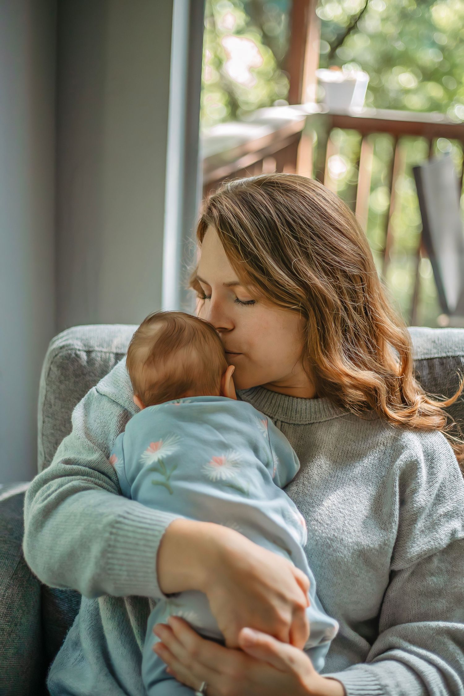 At-home newborn photo session in Santa Cruz, capturing a family’s intimate, candid moments with warmth and heartfelt connection