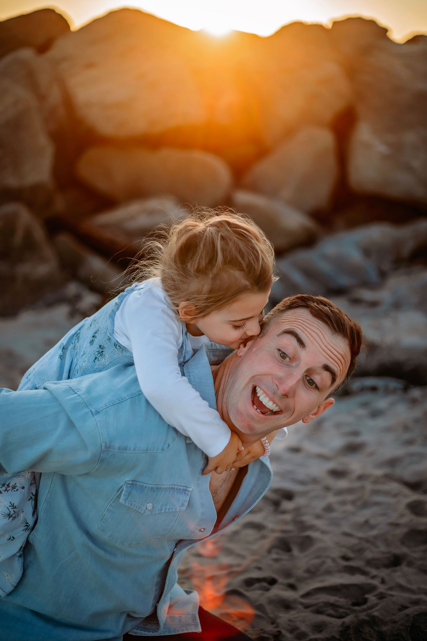 Family enjoying at the beach in Santa Cruz, captured in natural light with candid moments, ocean views, and a relaxed coastal setting