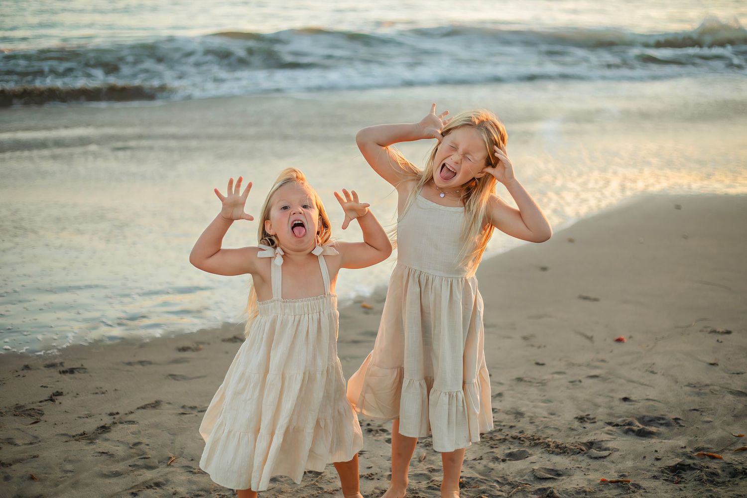 Children playing at the beach in Santa Cruz during golden hour, captured in natural light with candid, joyful moments and coastal scenery.
