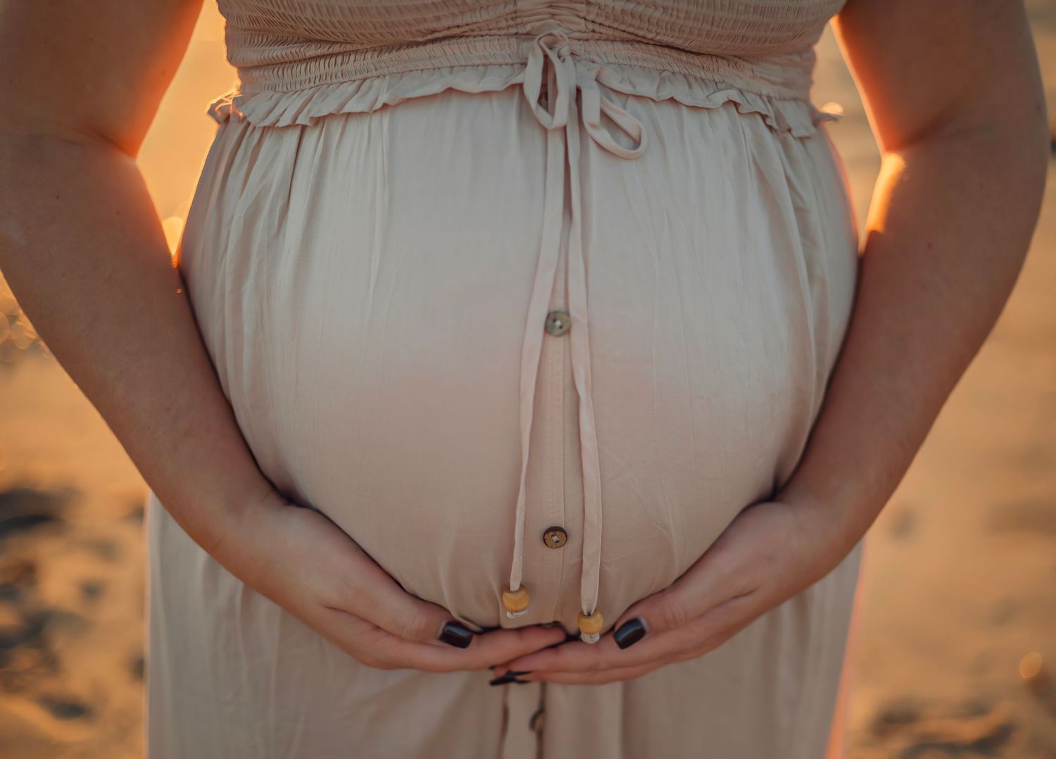 maternity photo session at a Santa Cruz beach, candid moments, ocean views, and a warm, relaxed coastal atmosphere.