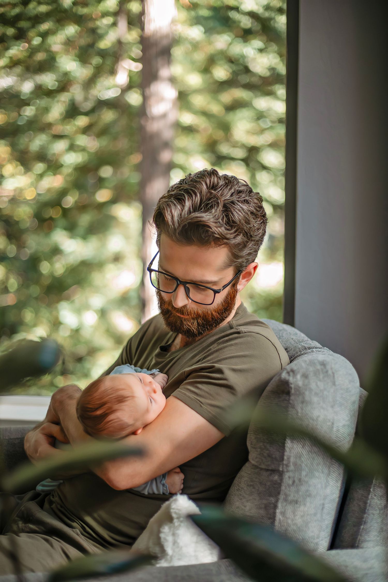 At-home newborn photo session in Santa Cruz, capturing a family’s intimate, candid moments with warmth and heartfelt connection