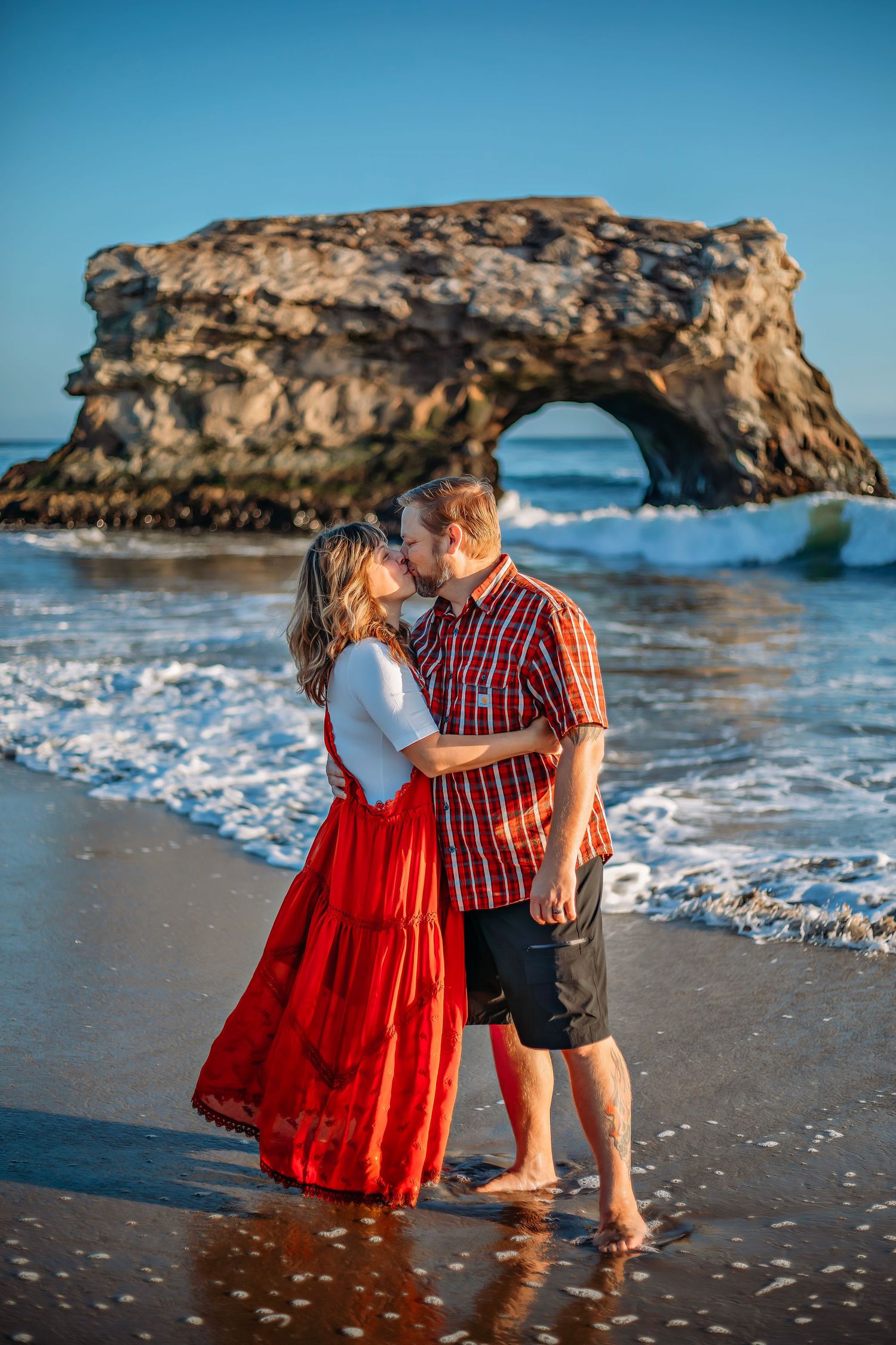 A couple enjoying at the beach in Santa Cruz, captured in natural light with candid moments, ocean views, and a relaxed coastal setting