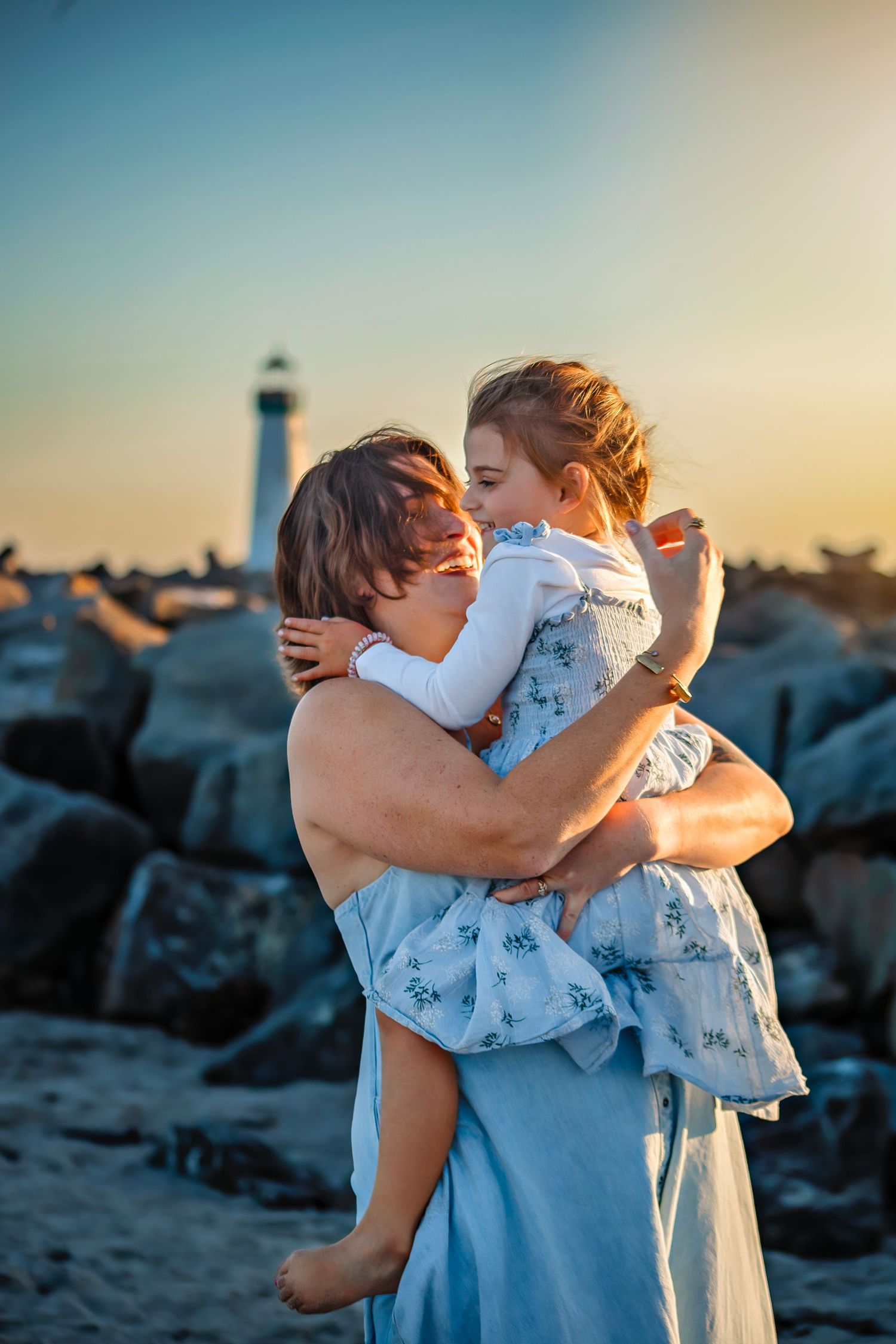 Family enjoying at the beach in Santa Cruz, captured in natural light with candid moments, ocean views, and a relaxed coastal setting