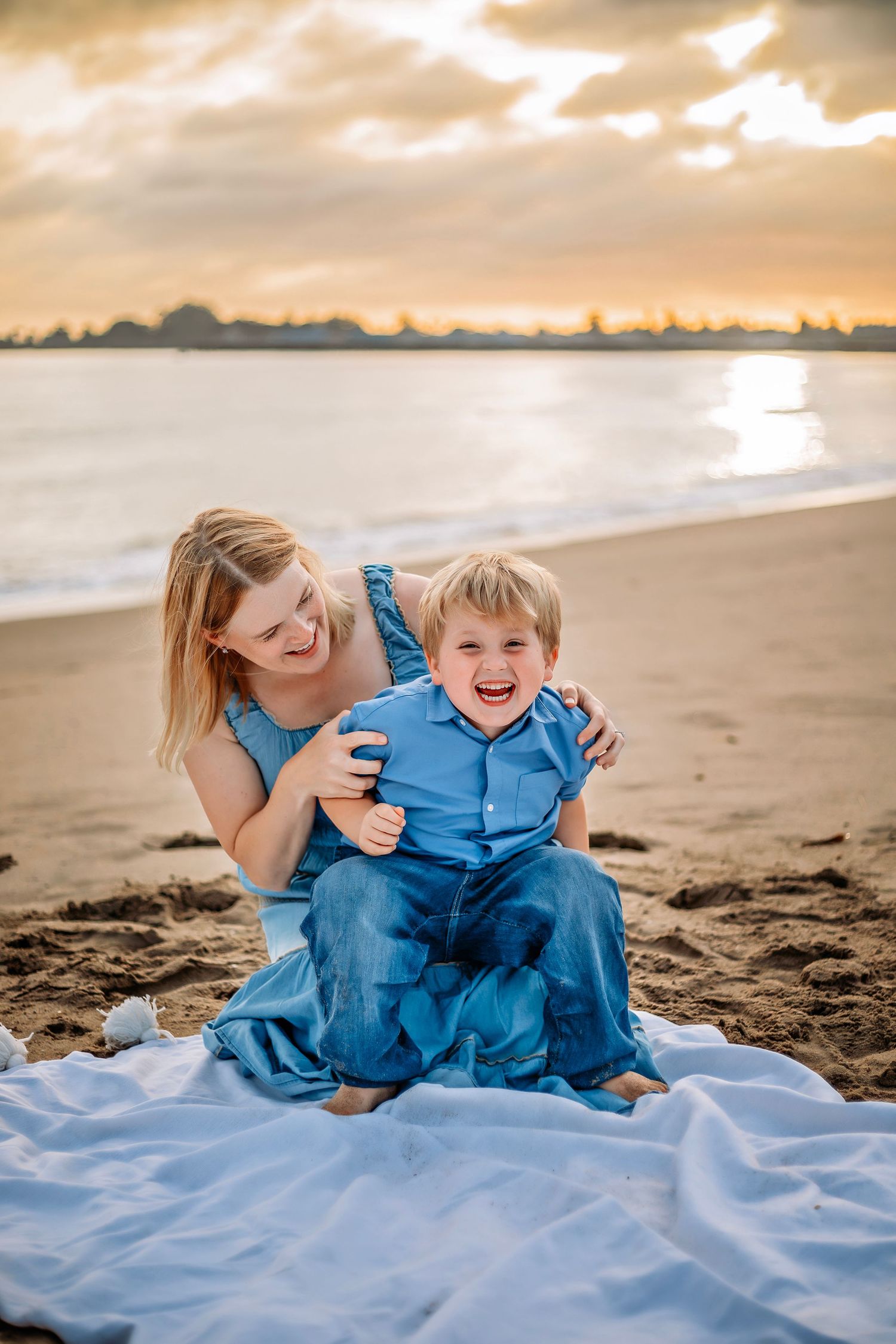 Family enjoying at the beach in Santa Cruz, captured in natural light with candid moments, ocean views, and a relaxed coastal setting