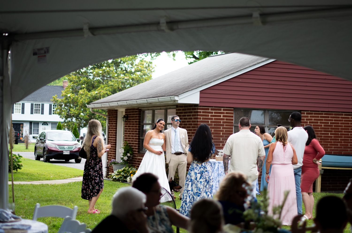 Photo of bride and groom at reception with their guests in Sparrows Point, MD