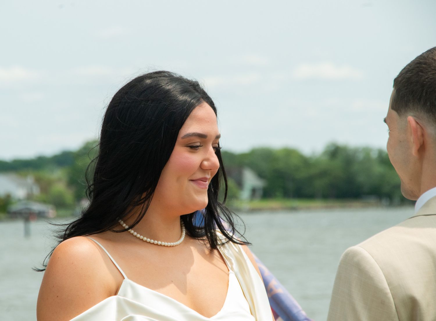 Photo of bride smiling during wedding ceremony in Baltimore, MD