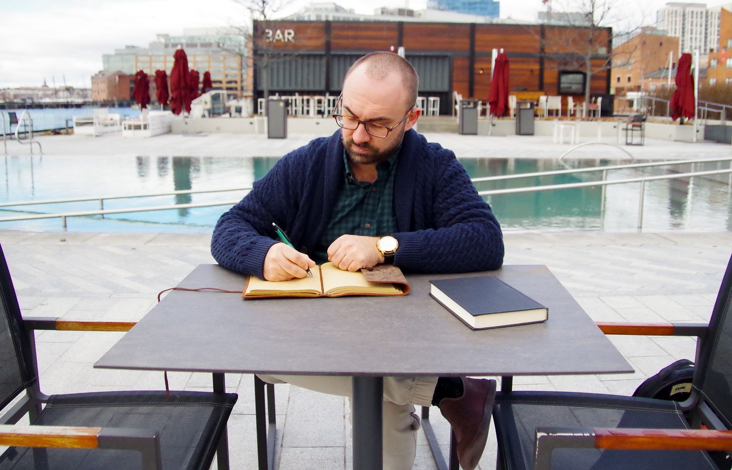 Branding business photo of man journaling in Fells Point, MD
