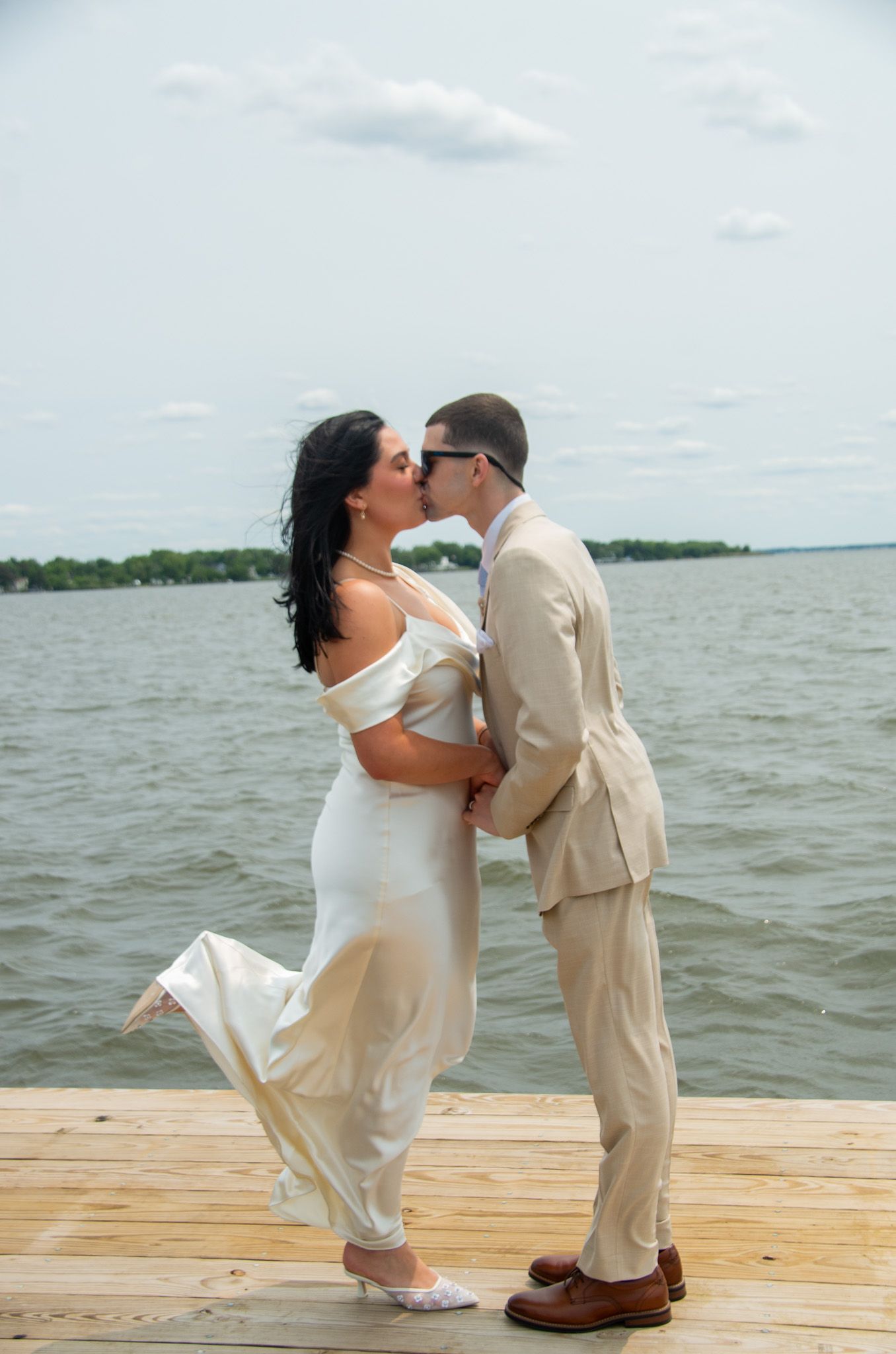 Wedding photo of husband and wife on the Chesapeake Bay in Baltimore, MD.