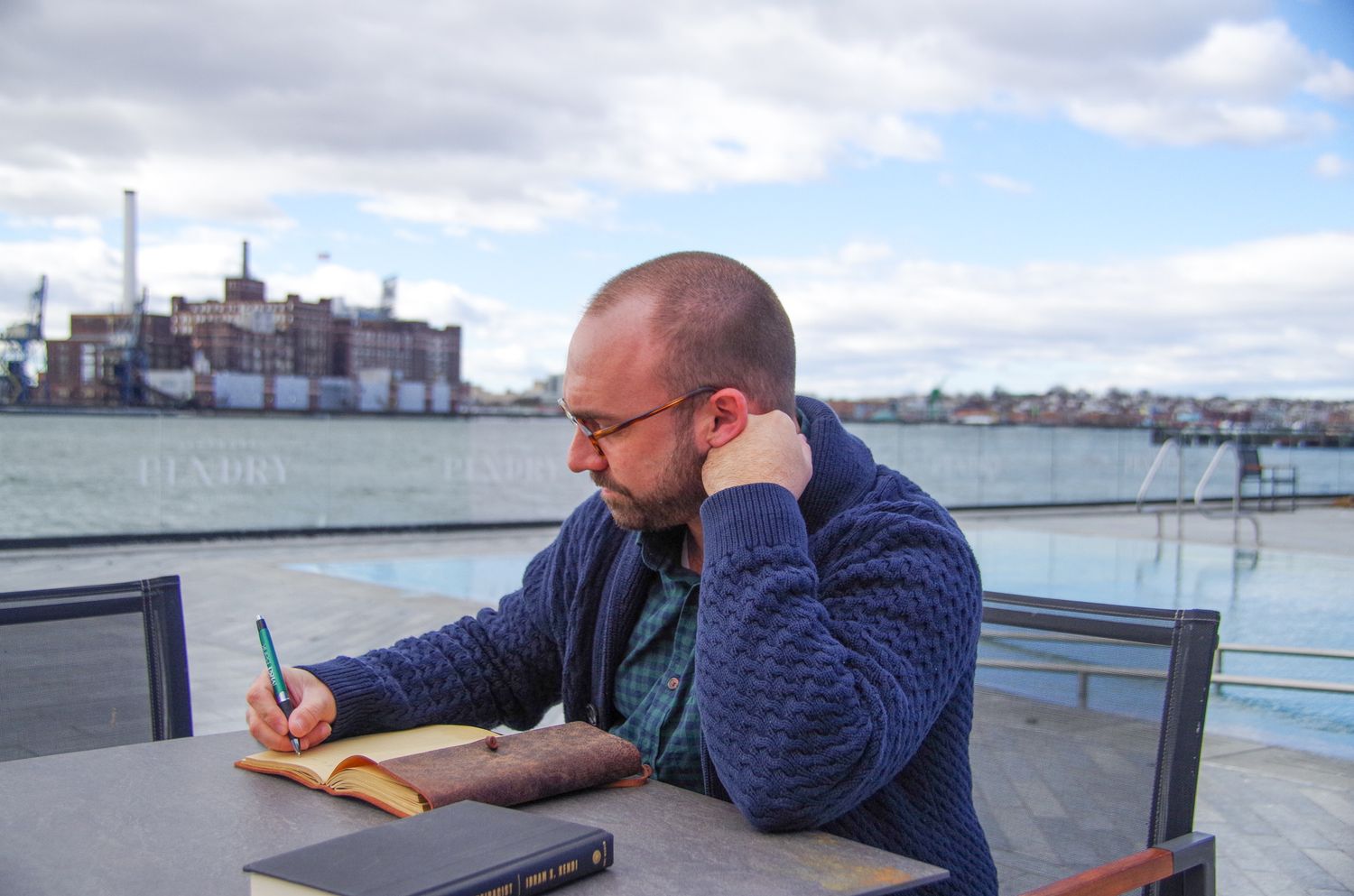 Branding business photo of man journaling in Fells Point, MD