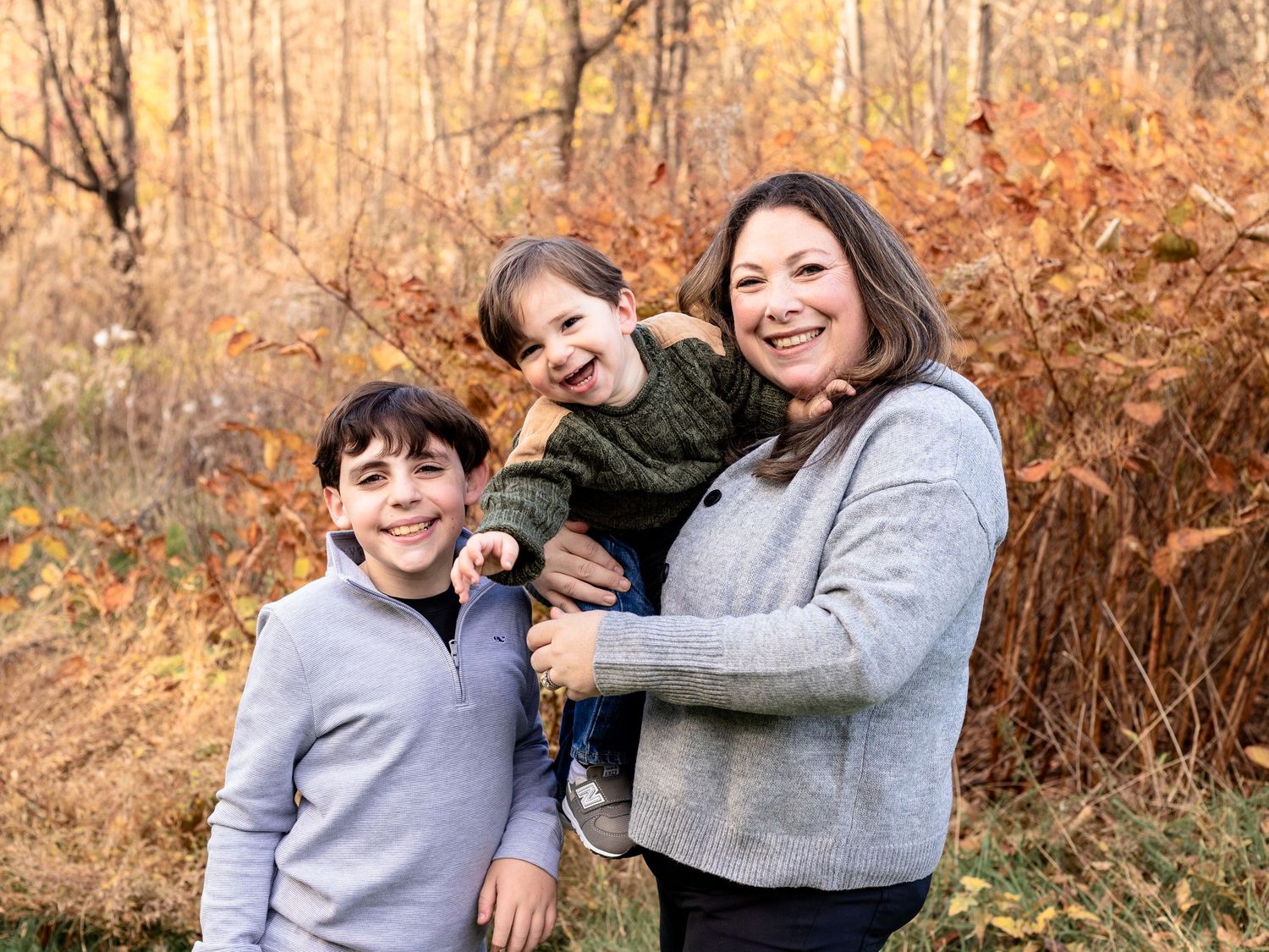 A mom with her two boys during a family photo session in Baltimore County, MD