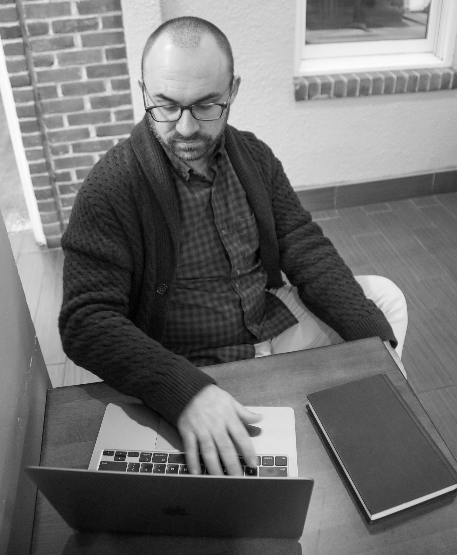 Branding business photo of man on his laptop in Fells Point, MD