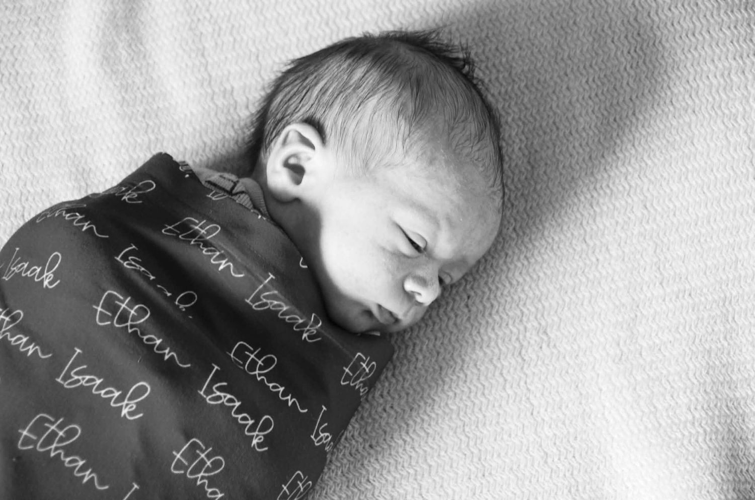 Newborn baby photo session with baby in swaddle in Baltimore, MD