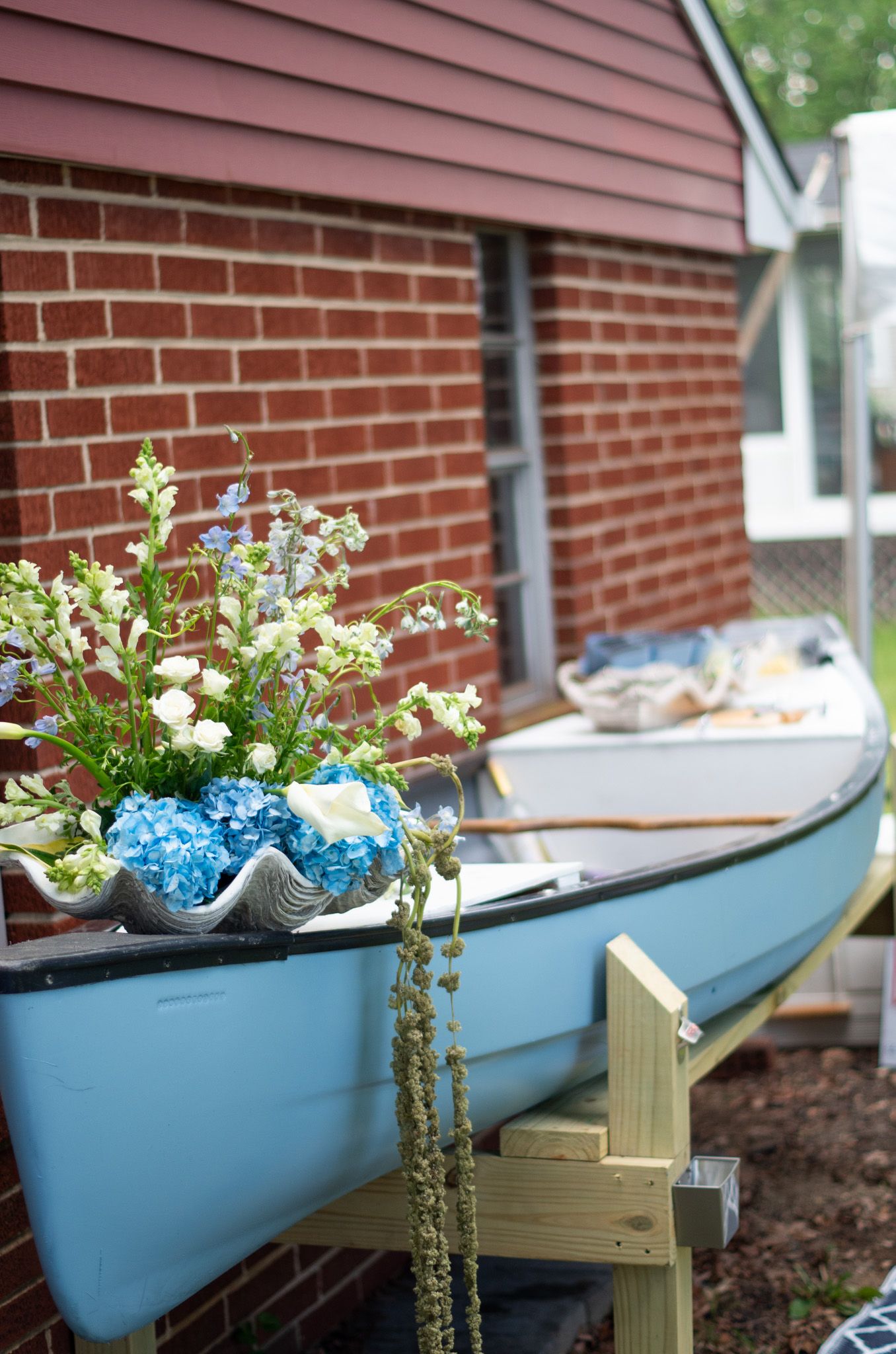Wedding reception photo of a blue canoe being used to hold iced beverages in Baltimore, MD