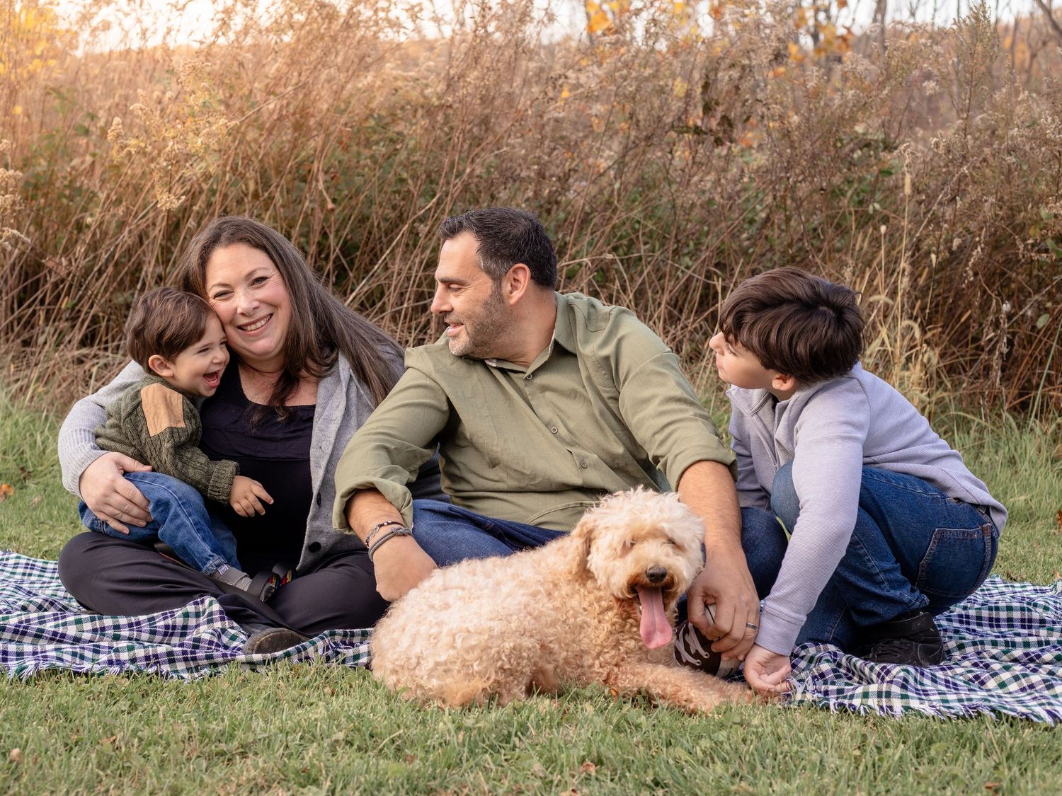 Photo of family of four with their dog during a family photo session in Baltimore, MD