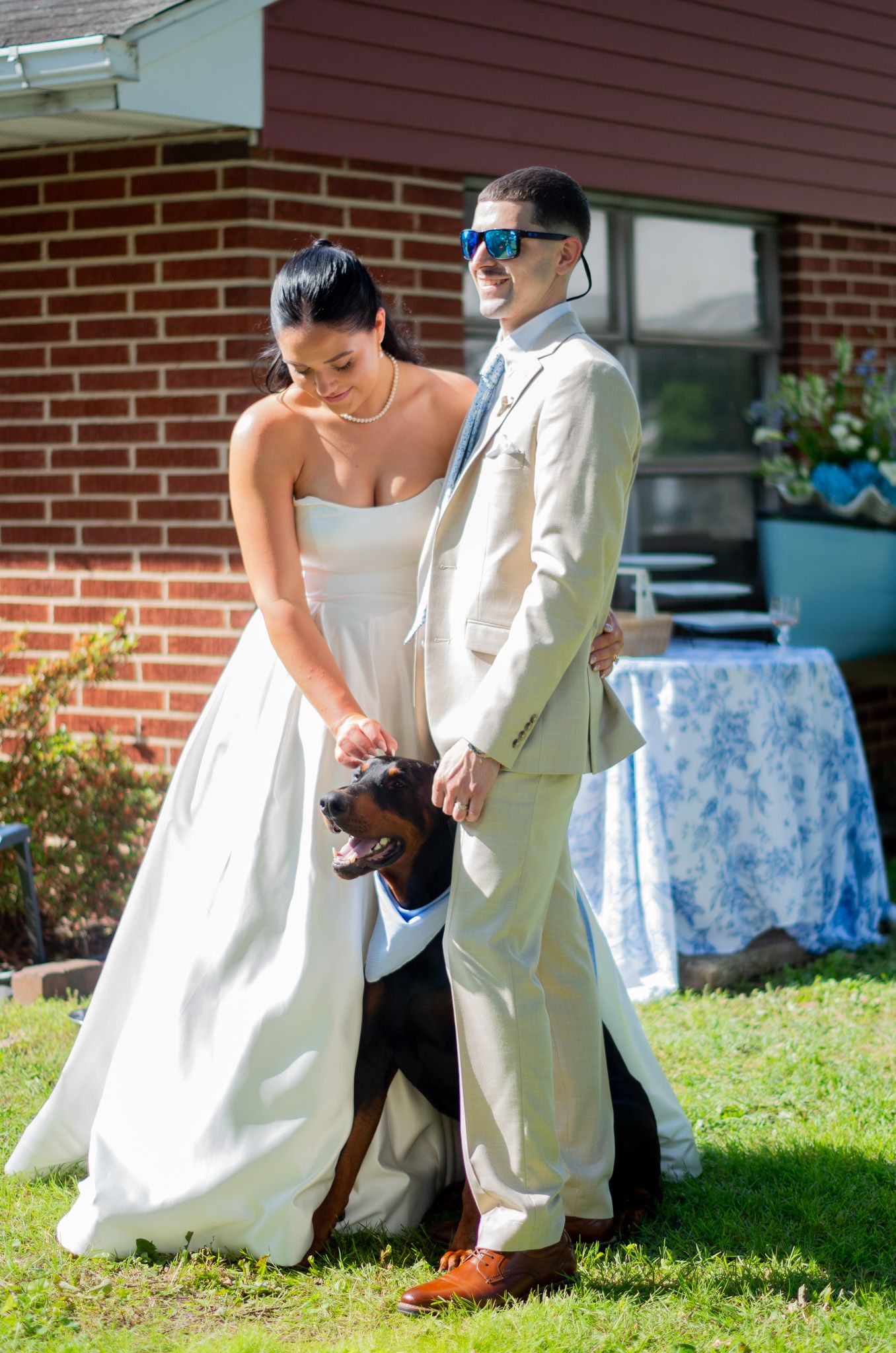 Photo of bride and groom at reception with their dog in Sparrows Point, MD