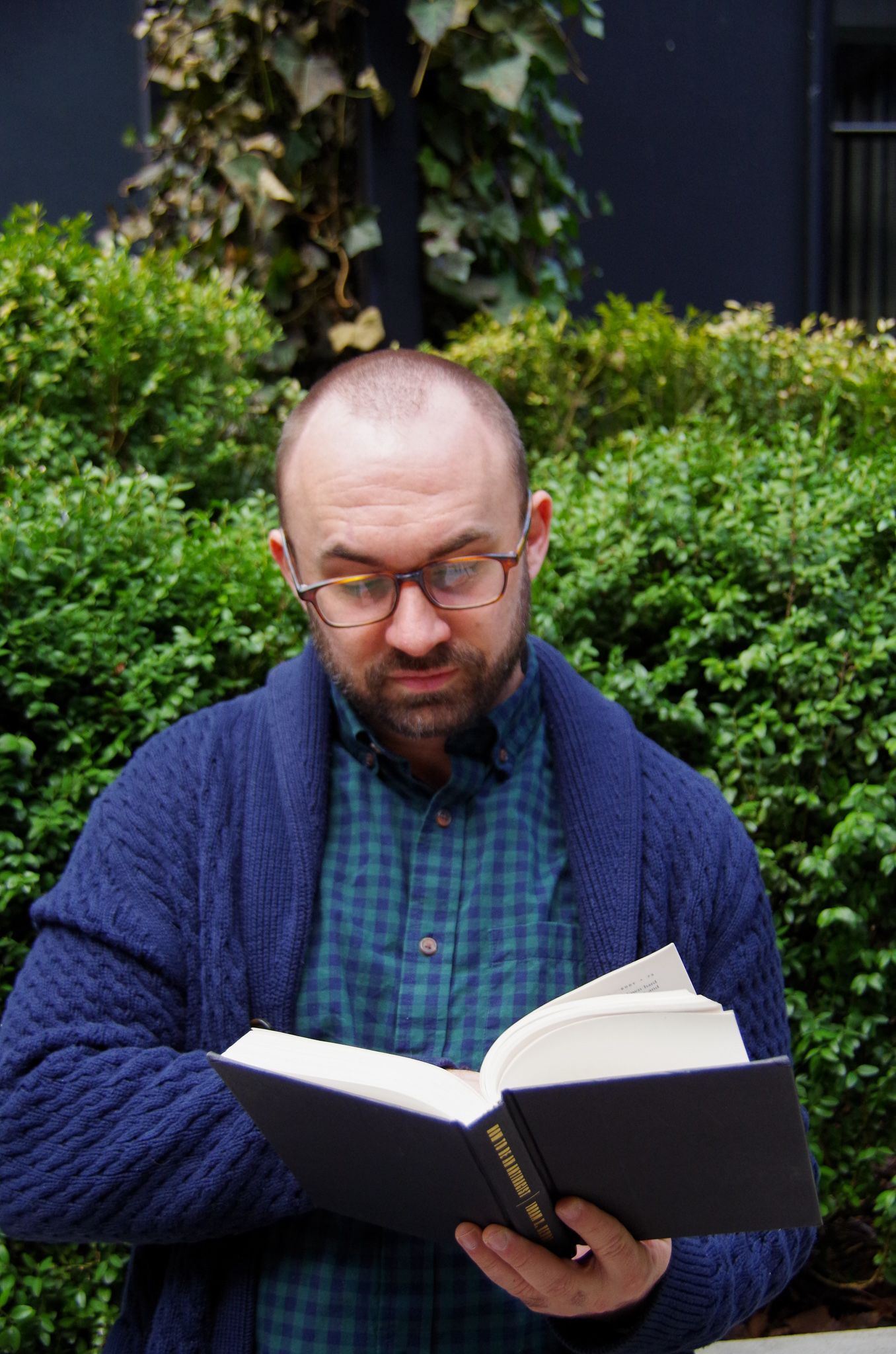 Branding business photo of man reading in Fells Point, MD
