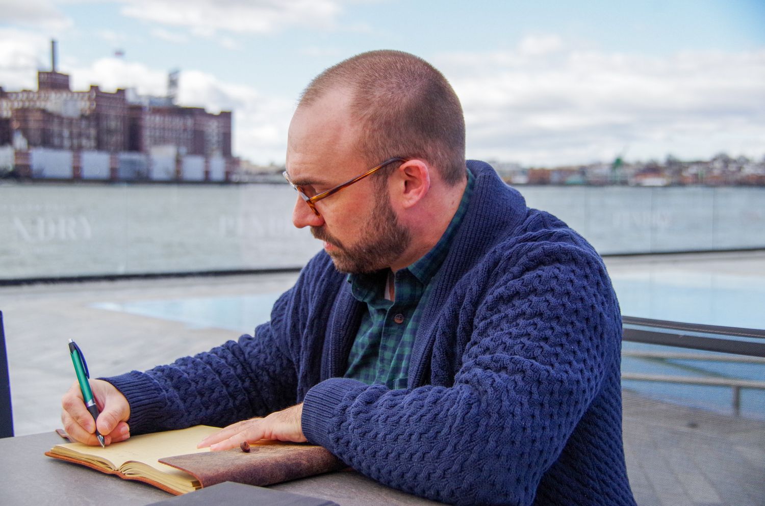 Branding business photo of man journaling in Fells Point, MD