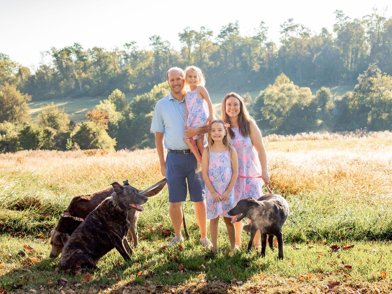 Family of four and their three dogs during a family photo session in Bel Air, MD