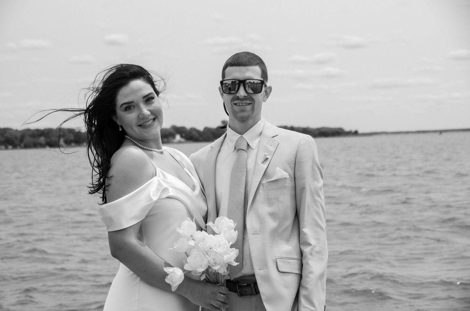 Black and white photo of bride and groom portrait on the Chesapeake Bay in Baltimore, MD