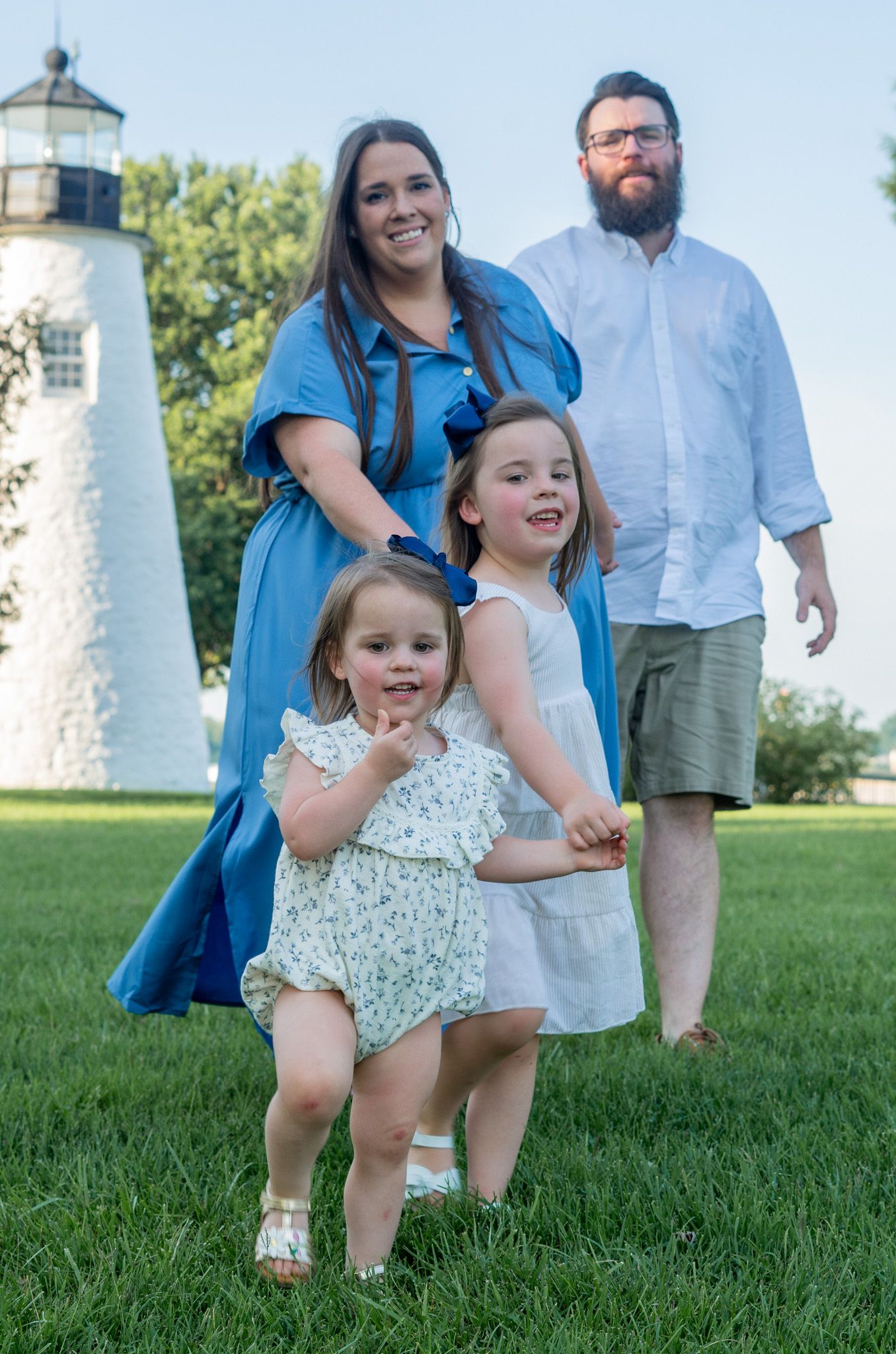 Family of four walking during a family photo session in Havre de Grace, MD