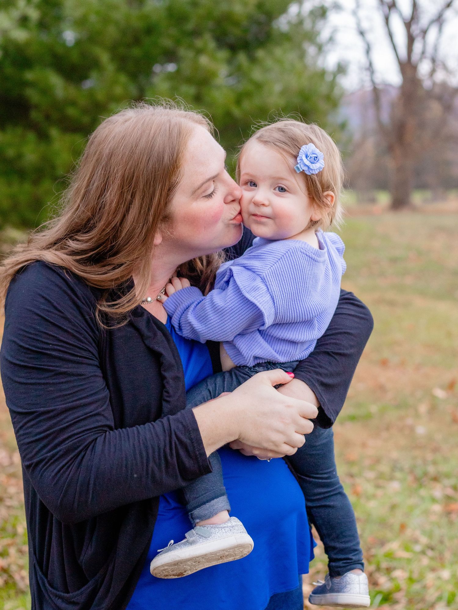 Mom kissing baby girl during Baltimore County, MD photo session