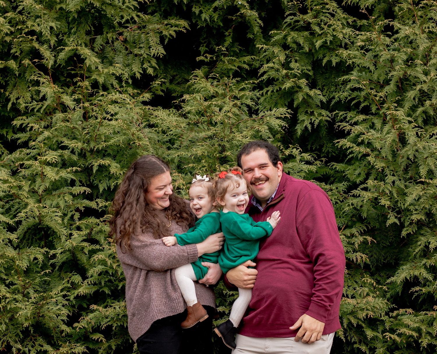 Family of four with twin girls during a family photo session in Harford County, MD
