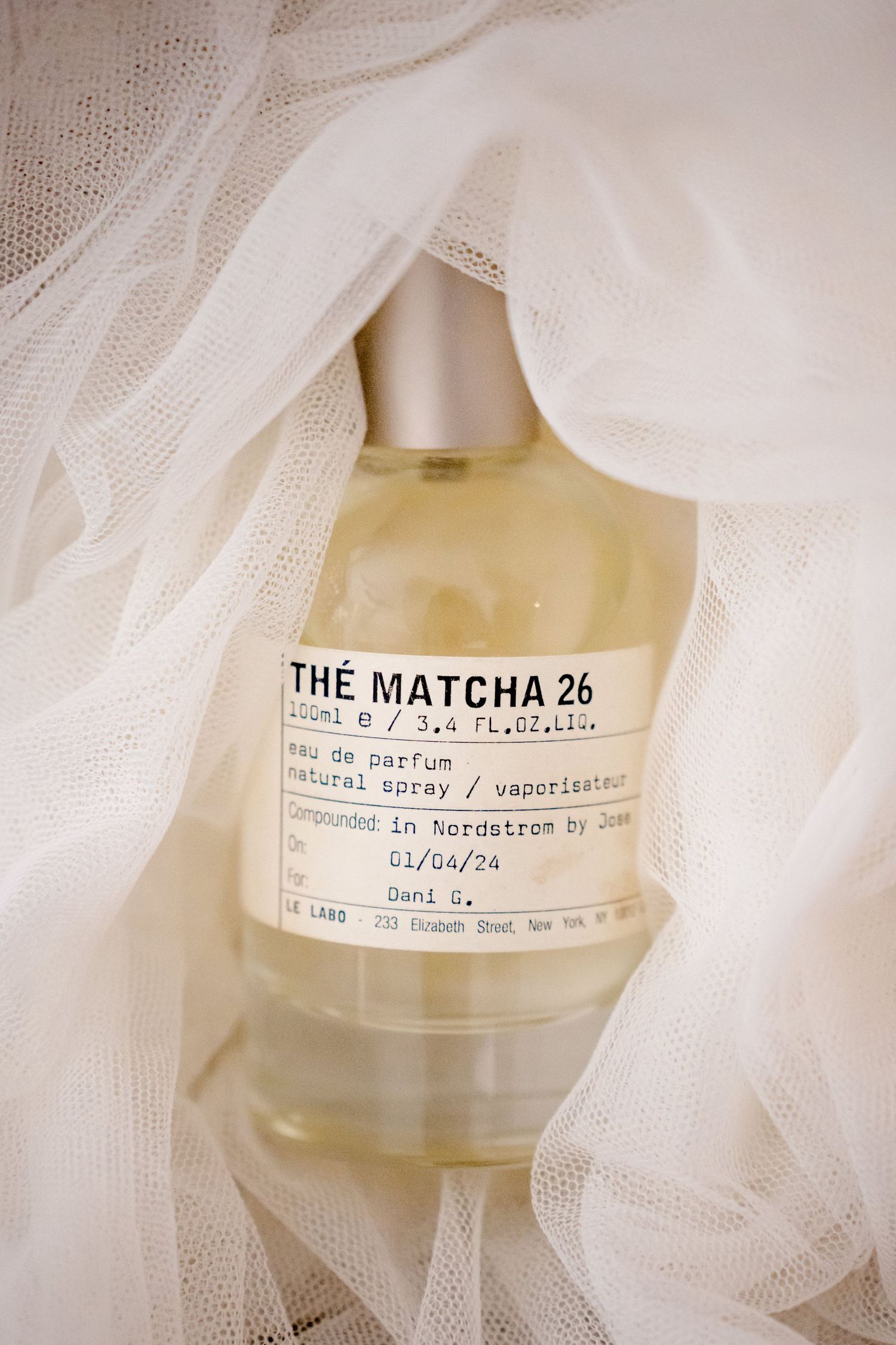 Luxury bridal perfume styled with a wedding veil for an editorial wedding flat lay in Costa Rica.