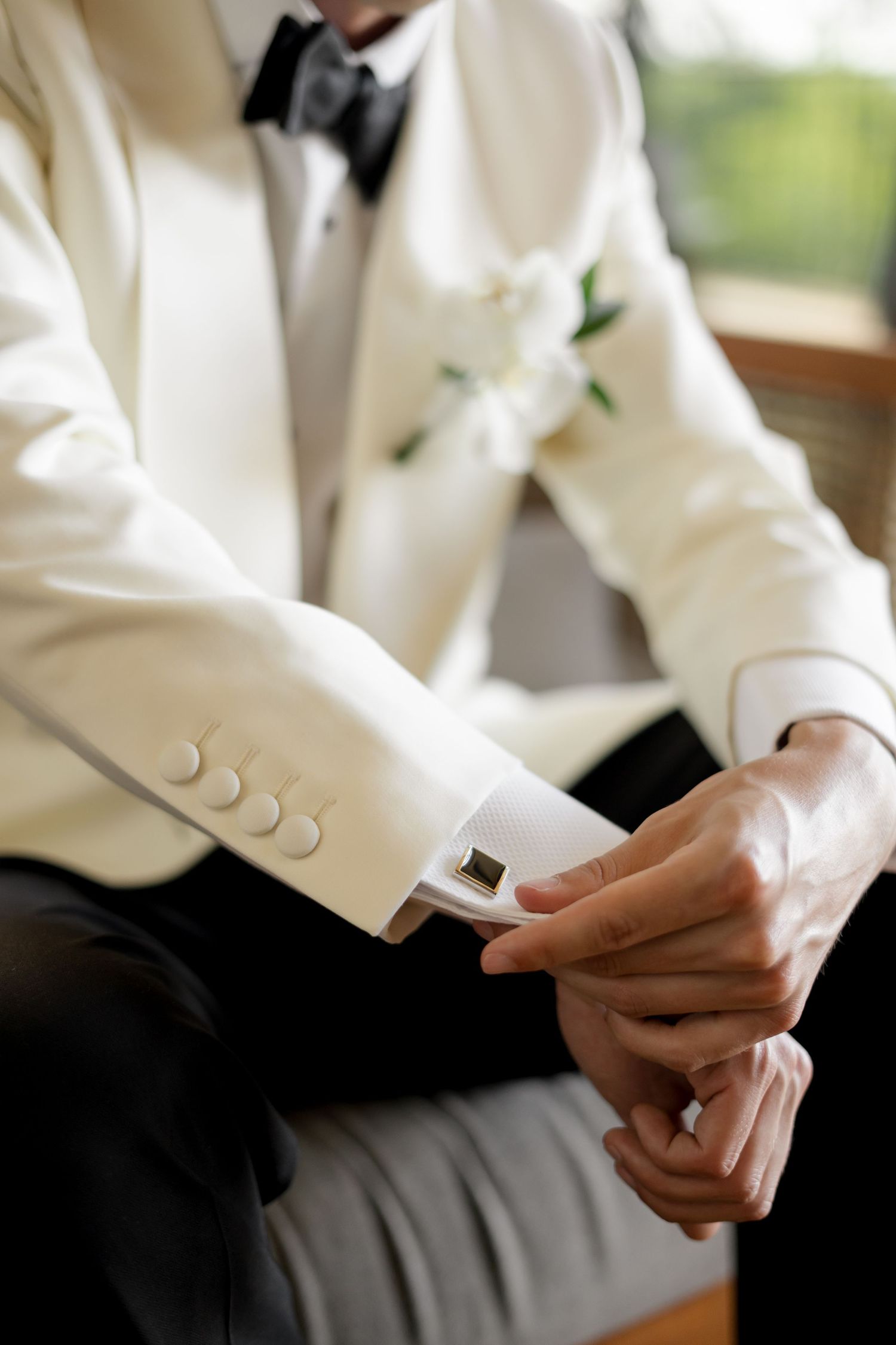 Groom fastening cufflinks before a luxury destination wedding in Papagayo, Guanacaste, Costa Rica.