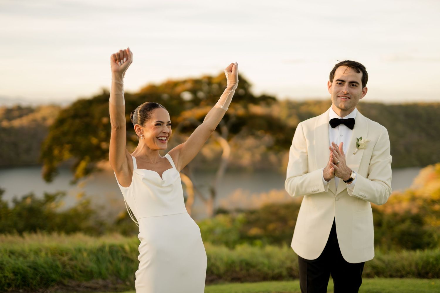 Newlyweds celebrating their wedding ceremony with joyful applause during a destination wedding in Guanacaste, Costa Rica.