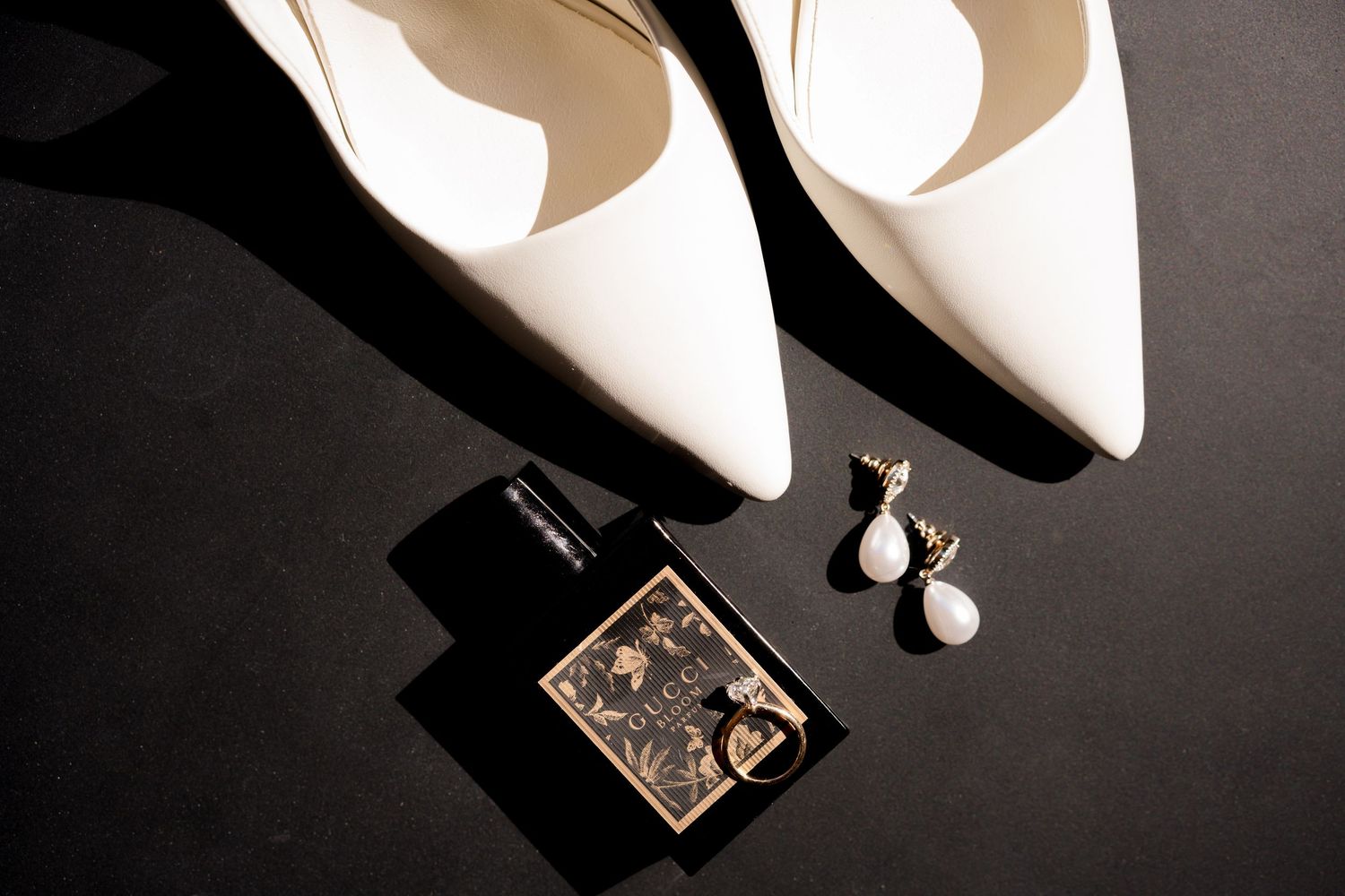 Designer bridal shoes, jewelry, and perfume styled for a luxury destination wedding in Guanacaste, Costa Rica.