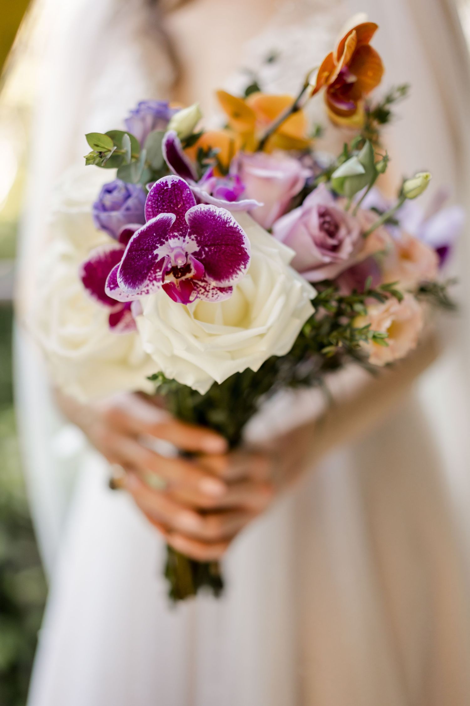 Luxury bridal bouquet featuring white roses, orchids, and tropical flowers for a destination wedding in Guanacaste, Costa Rica.
