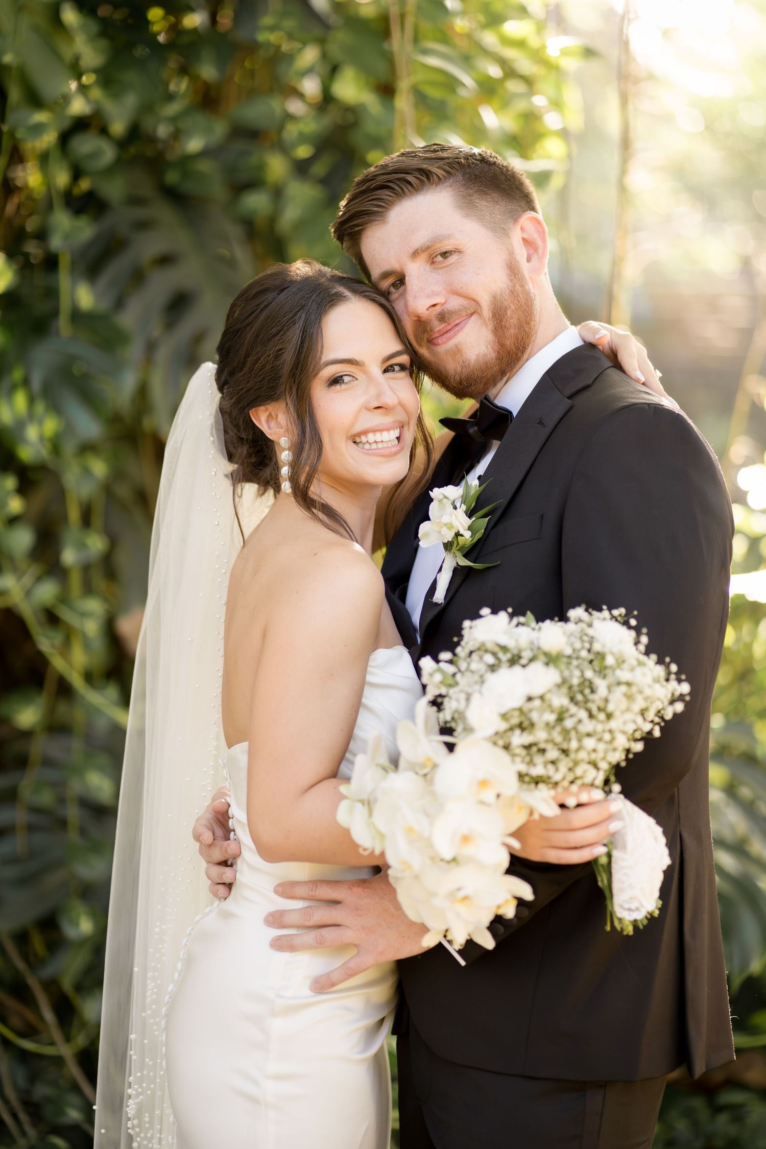 Romantic wedding portrait capturing genuine connection between newlyweds surrounded by lush tropical gardens, Mangroove Hotel in Guanacaste