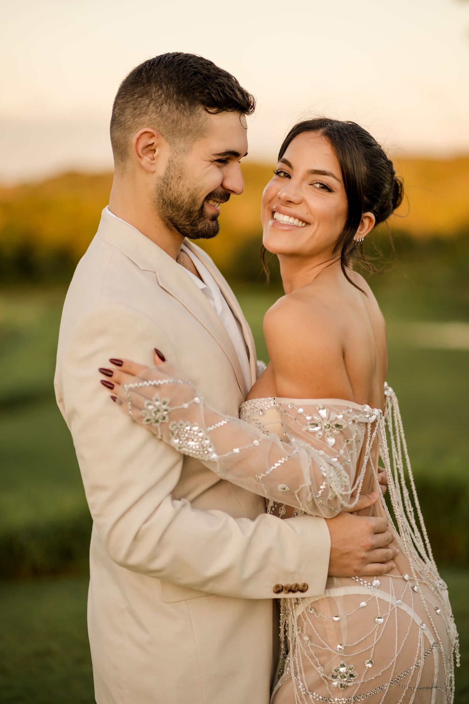 Newlyweds sharing a joyful embrace during golden hour wedding portraits in Papagayo, Costa Rica.