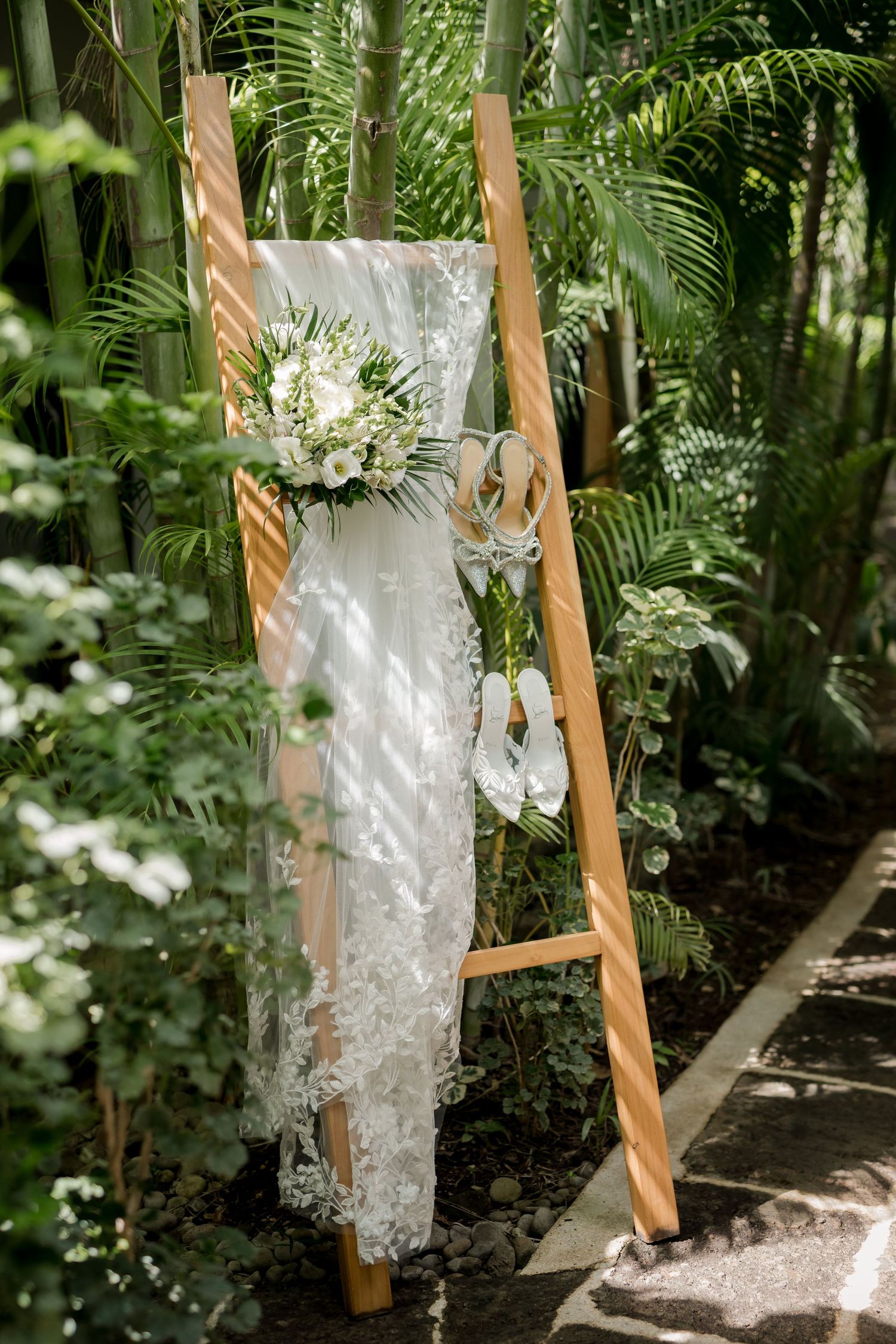 Luxury wedding dress displayed among tropical gardens before a destination wedding in Guanacaste, Costa Rica.