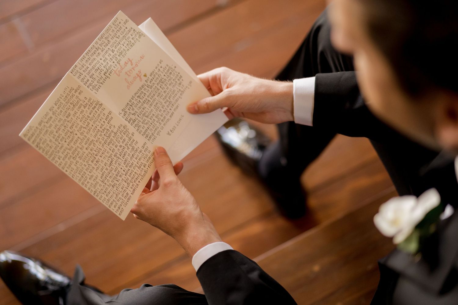 Groom reading handwritten wedding vows before a luxury destination wedding ceremony in Costa Rica.