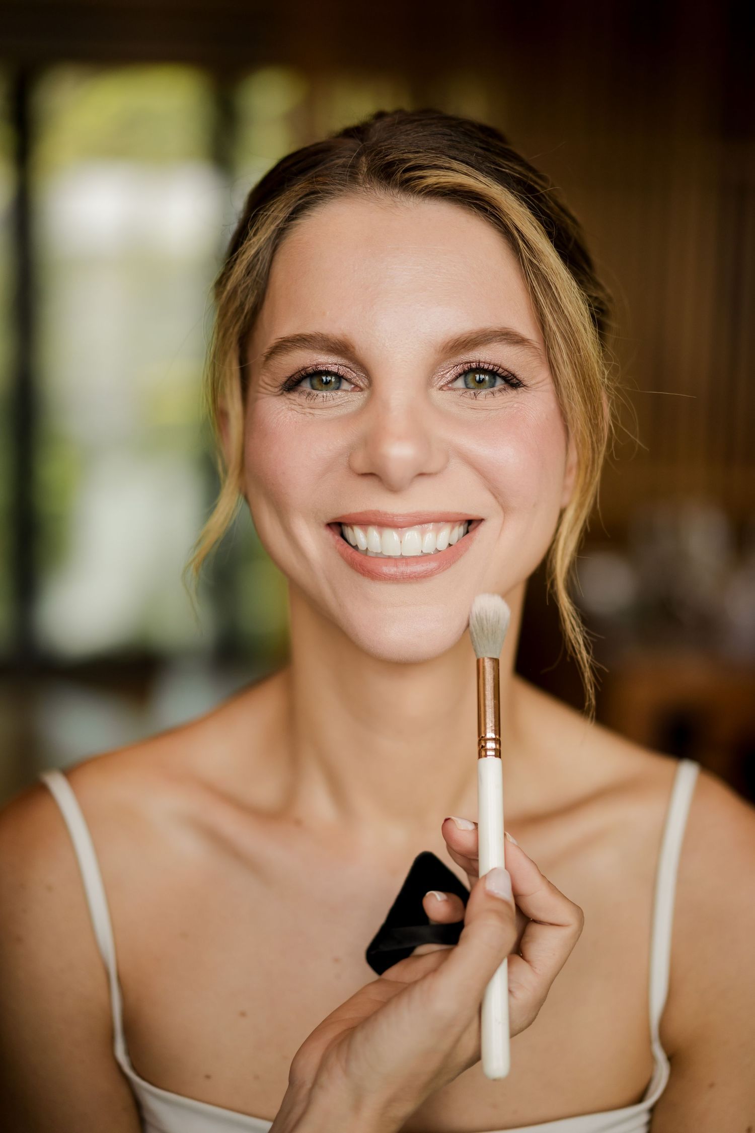Professional bridal makeup application creating a fresh, radiant look for an elegant wedding day in Papagayo.