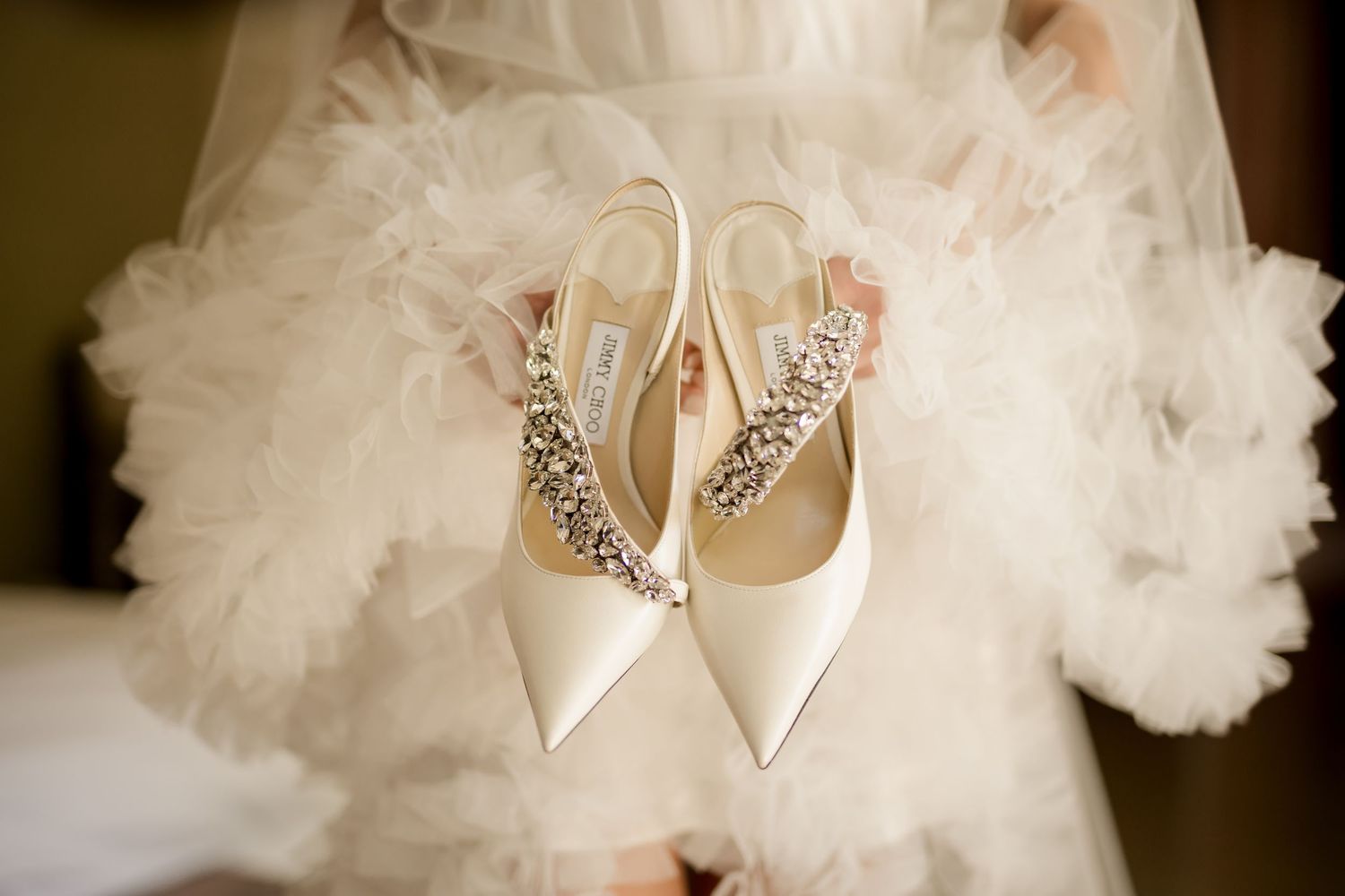 Designer bridal shoes styled with a couture wedding gown before a luxury destination wedding in Costa Rica.
