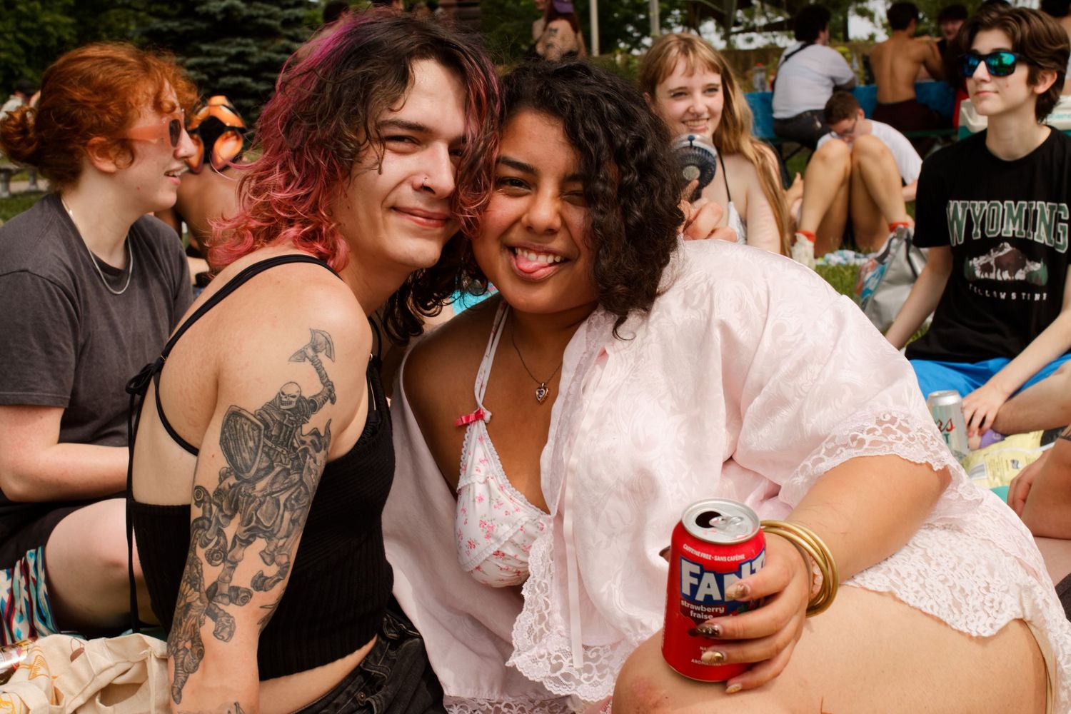 Two people posing for a photo during a picnic event.