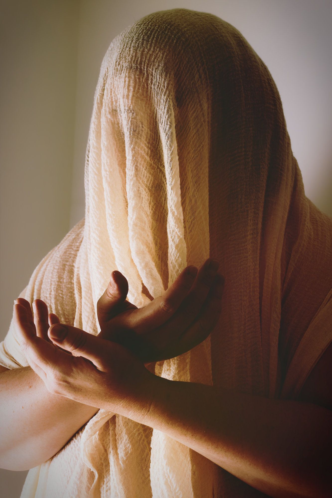 Fantasy photo of person with a veil covering their face