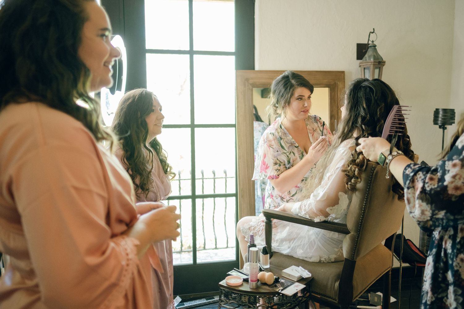 Bride sitting for hair and makeup at Chateau Selah wedding in Tennessee.
