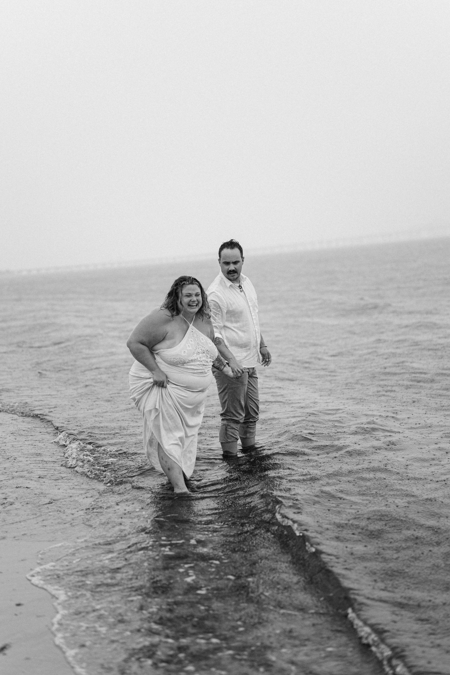 A romantic rainy engagement session at Terrapin Nature Park in Maryland.