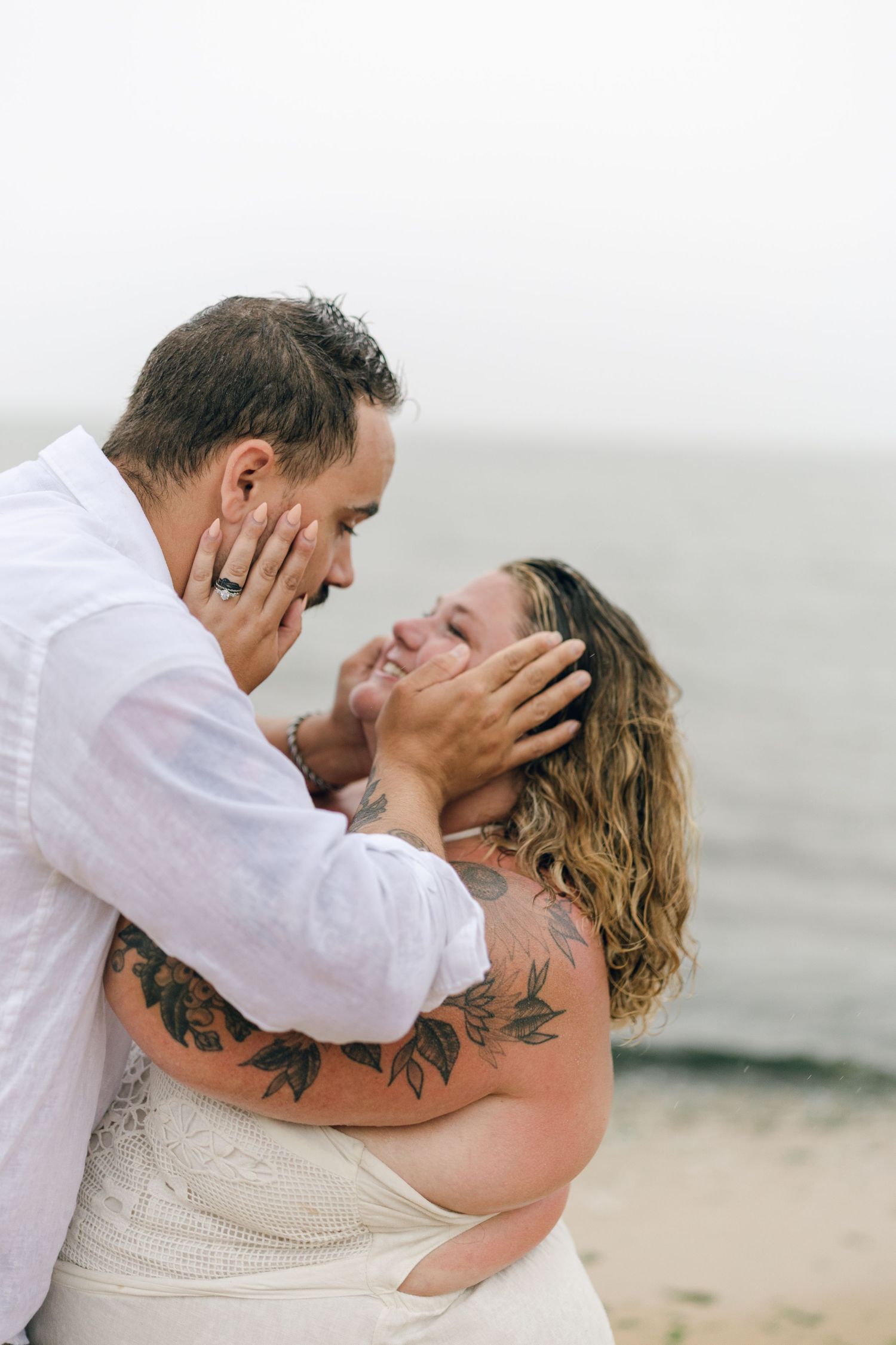 A romantic rainy engagement session at Terrapin Nature Park in Maryland.