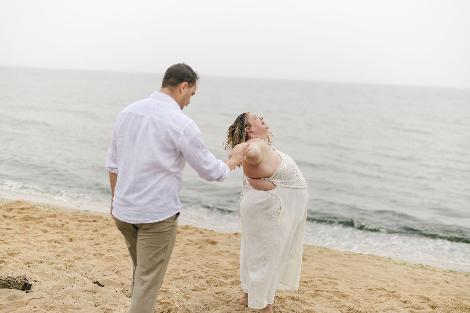 A romantic rainy engagement session at Terrapin Nature Park in Maryland.