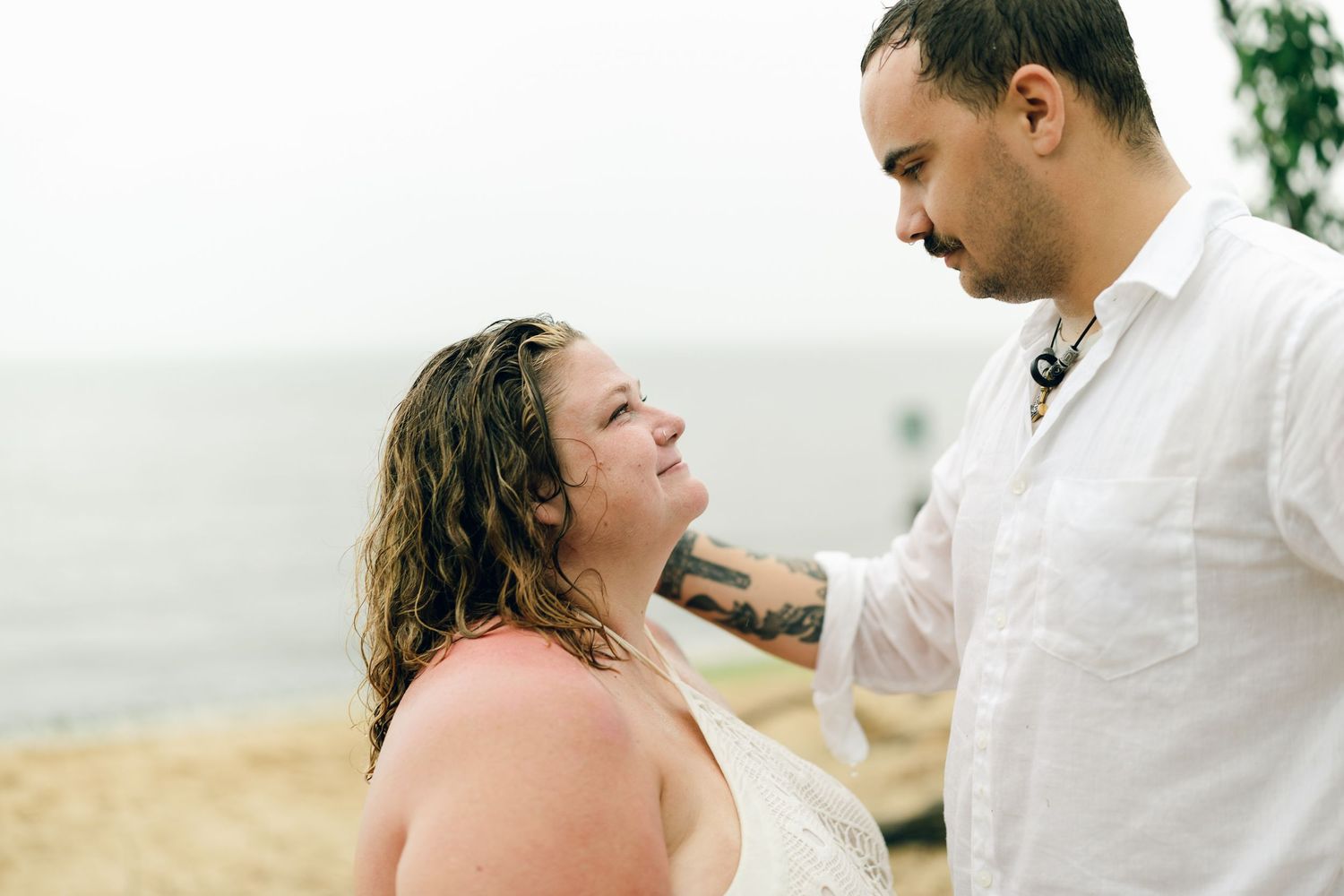 A romantic rainy engagement session at Terrapin Nature Park in Maryland.
